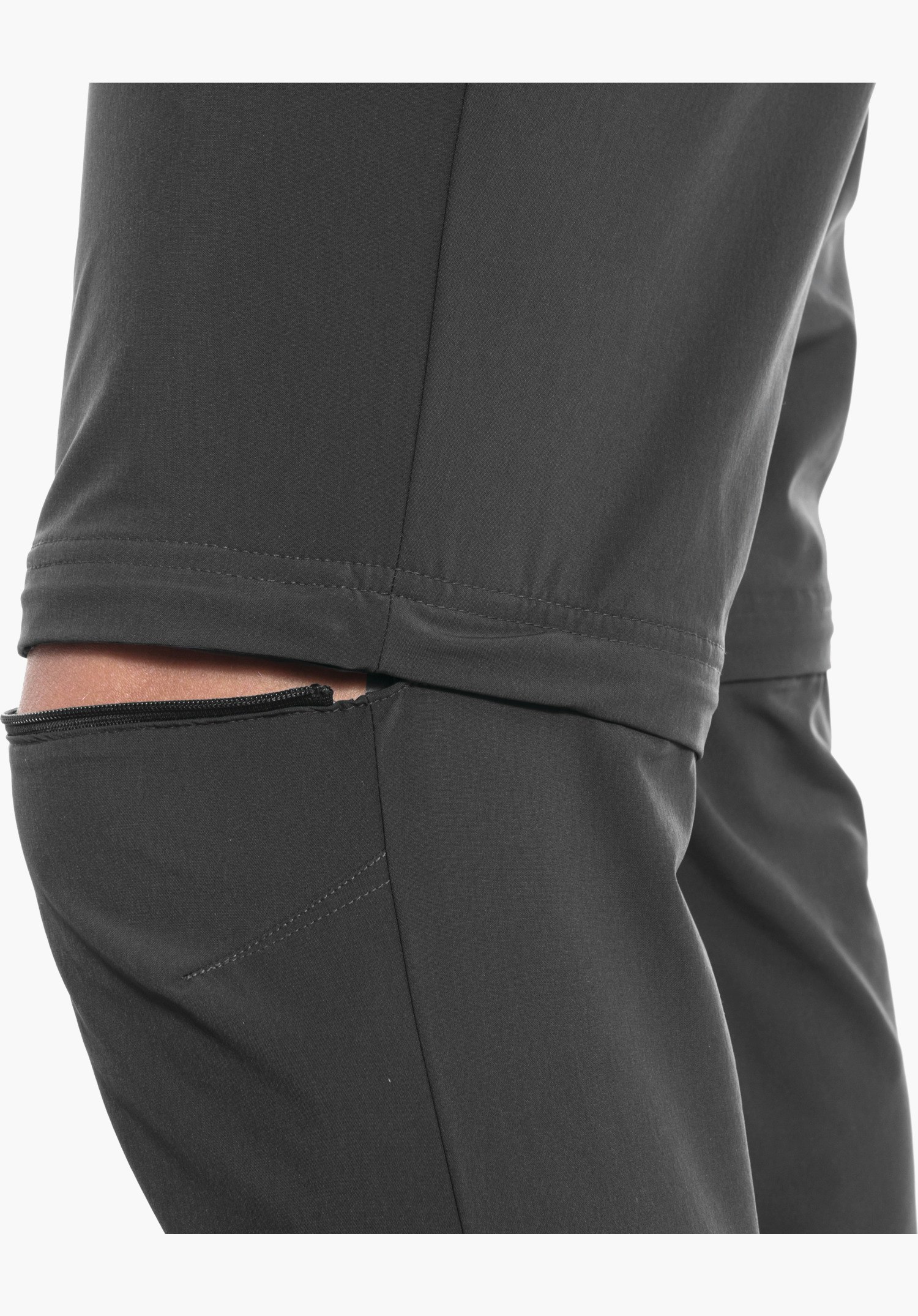 Pants Folkstone Zip Off, the zip above the knee allowing the leg to be detached in the grey technical fabric, close-up against a white background.