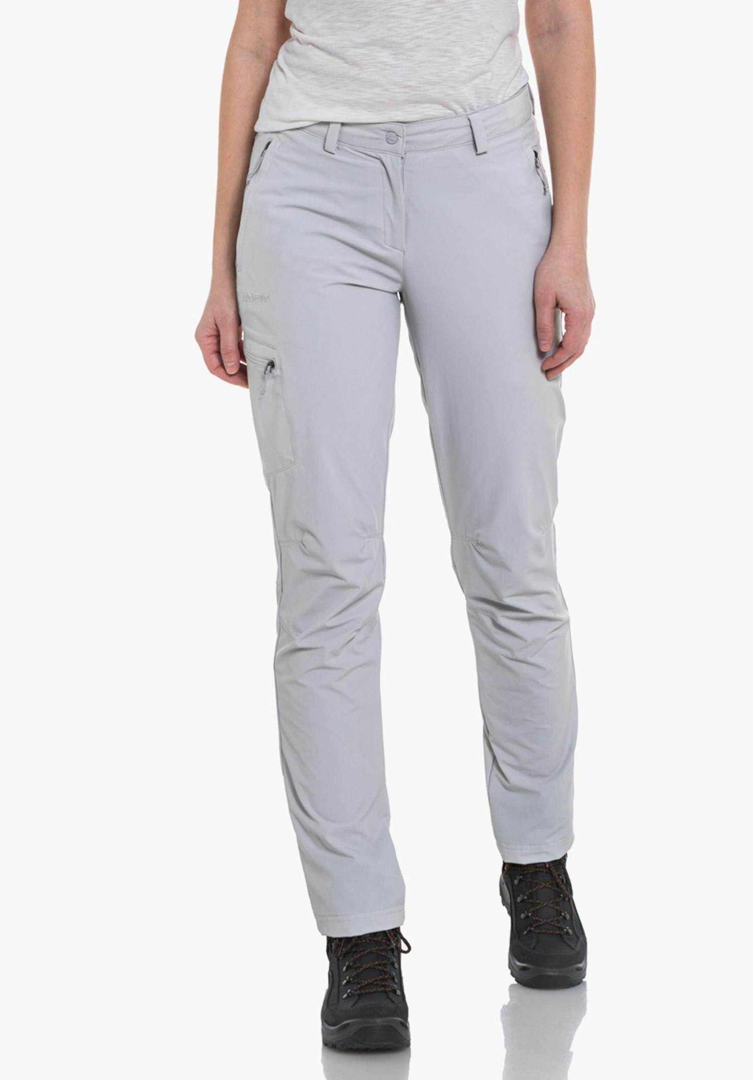 Pants Ascona woman stands front-facing with hands at her sides, wearing a white T-shirt, light grey trousers and black hiking shoes; neutral white background.