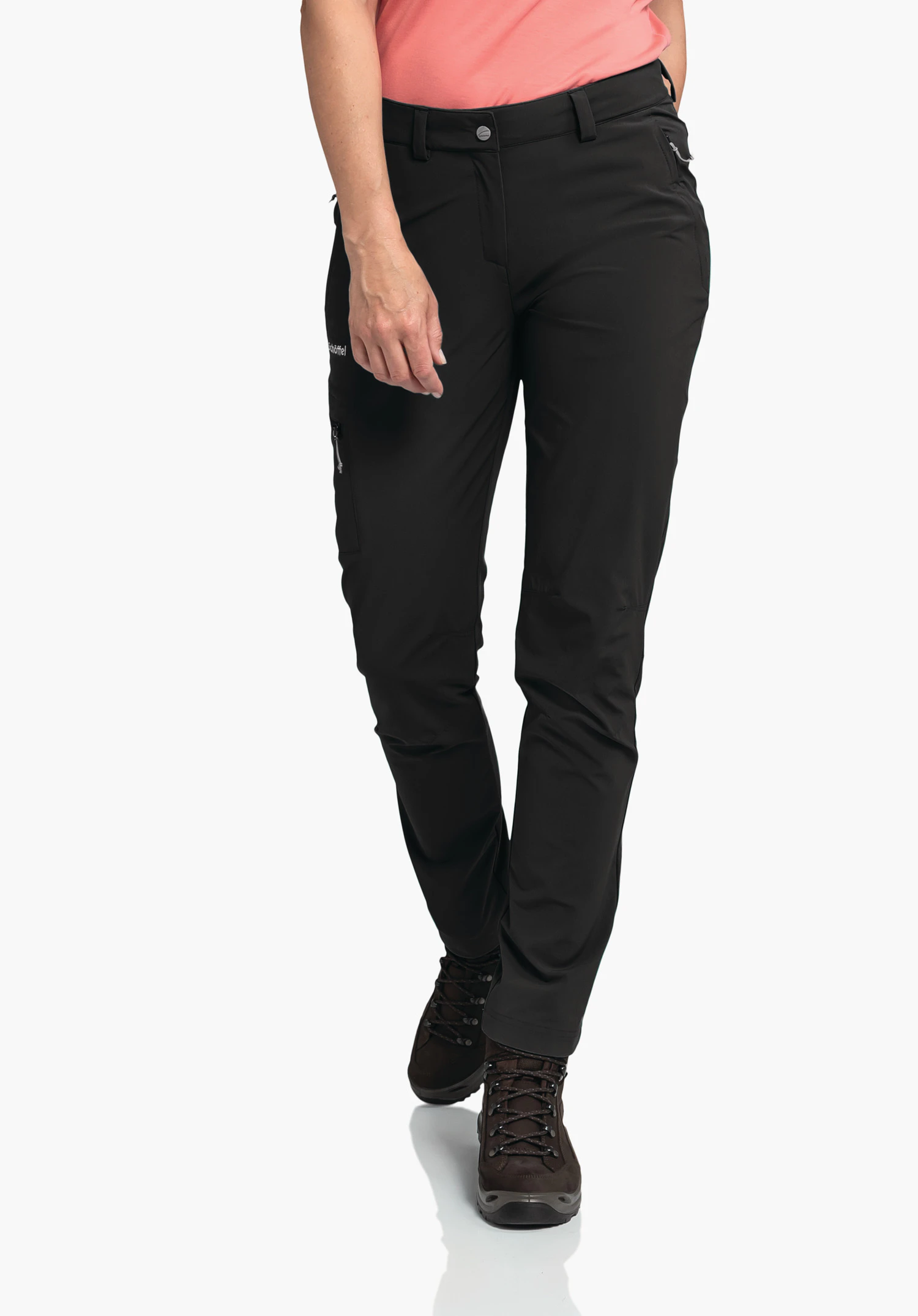 Pants Ascona in black. The model stands frontally, taking a step forward and wearing the trousers with a visible Schöffel-Logo on the right leg pocket against a neutral background.