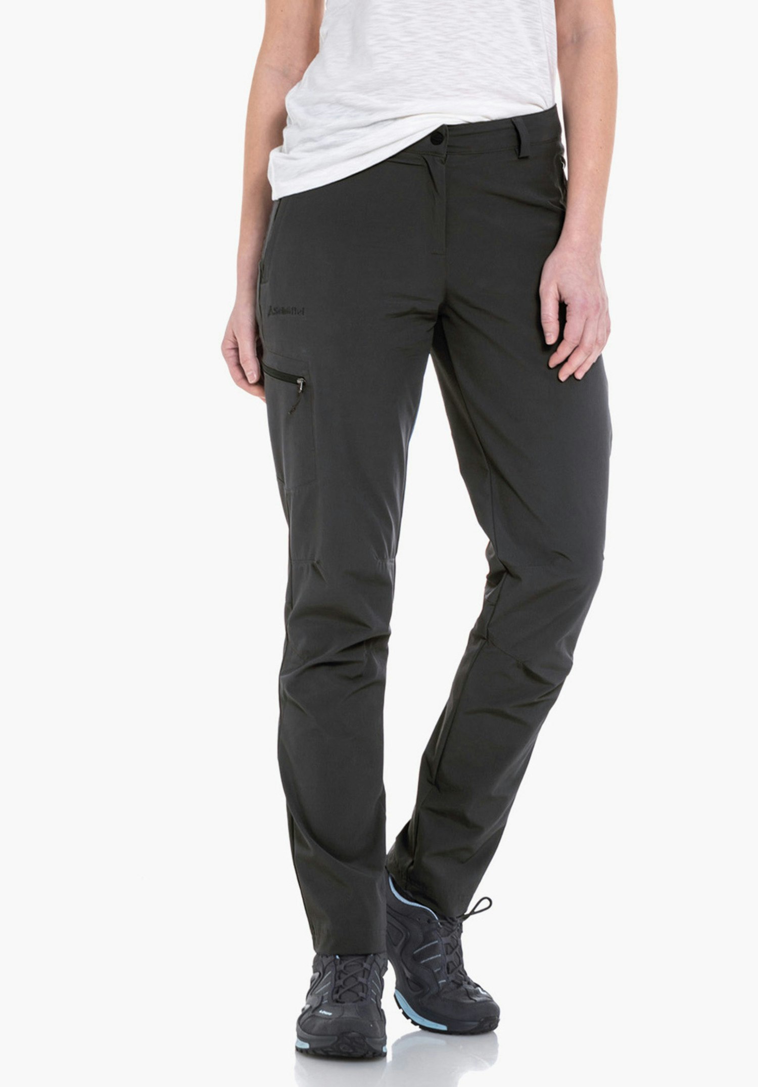 Pants Ascona dark grey outdoor trousers, worn by a standing person; legs slightly apart, combined with a light green and red checked shirt and light grey hiking shoes, white studio background.