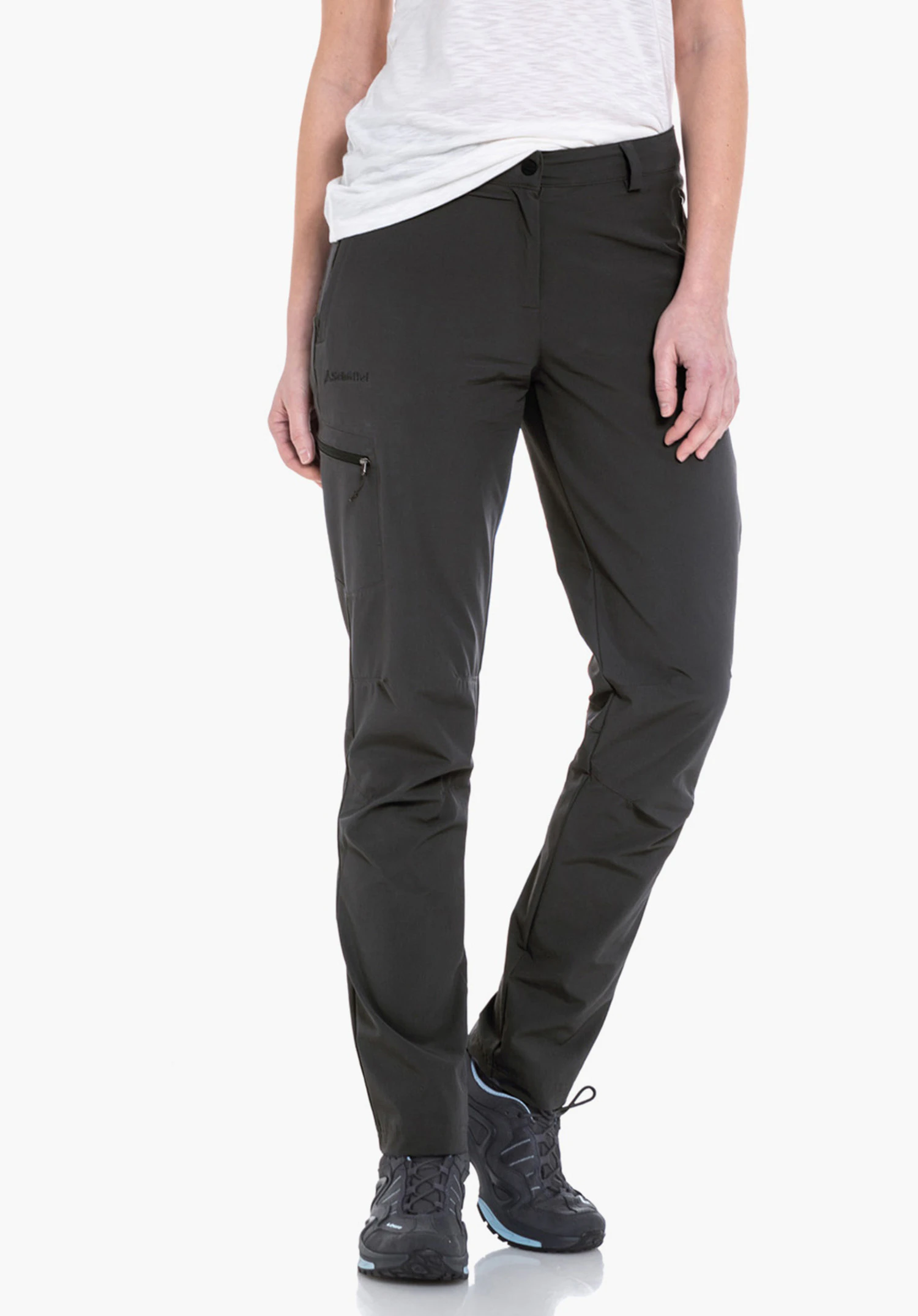 Pants Ascona dark grey outdoor trousers, worn by a standing person; legs slightly apart, combined with a light green and red checked shirt and light grey hiking shoes, white studio background.