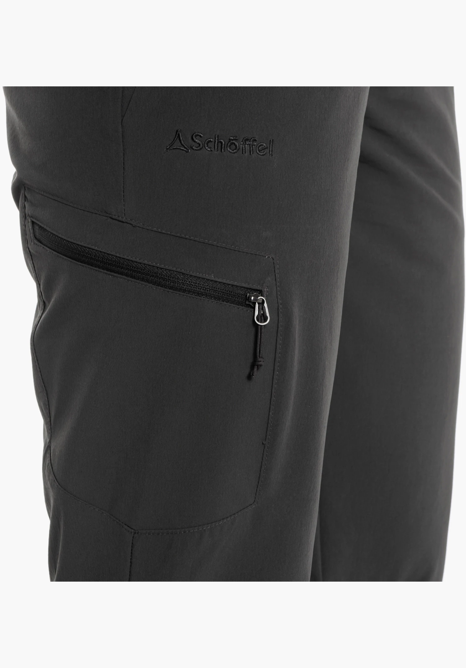 Pants Ascona features the Schöffel logo above the zipped leg pocket on the grey technical fabric. Close-up against a white/neutral background.