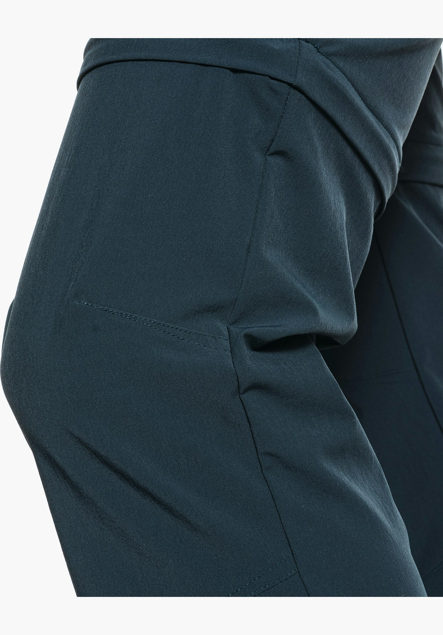Pants Ascona Zip Off showing the pre-shaped knee section and the structure of the blue fabric, close-up against a white background.