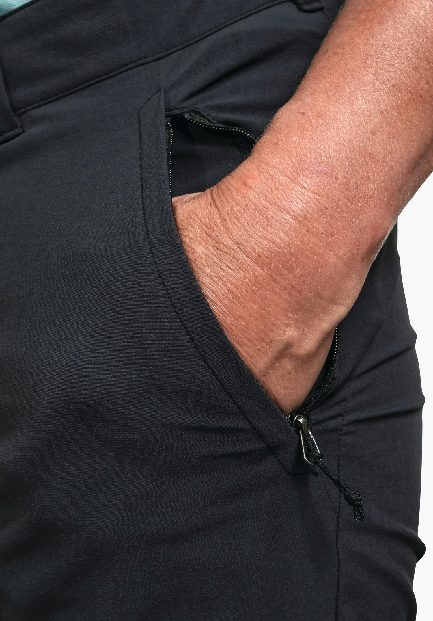 Pants Engadin1 shows the side zip pocket and belt loops on the waistband in black, close-up against a white/neutral background.