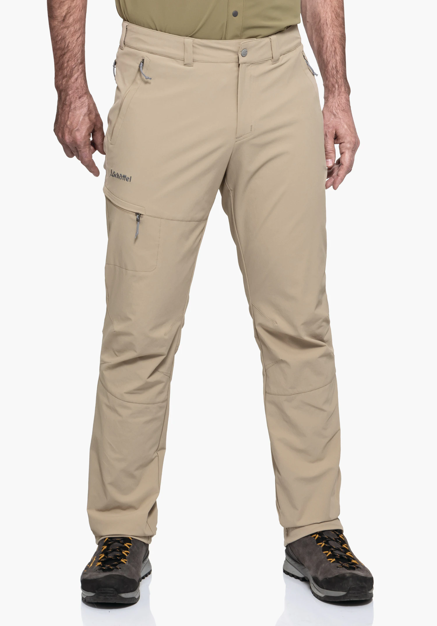 Pants Koper1 in beige features a model in a front-facing, standing pose against a neutral background. These outdoor trousers impress with their functional cut and the subtly placed Schöffel logo on the right thigh.
