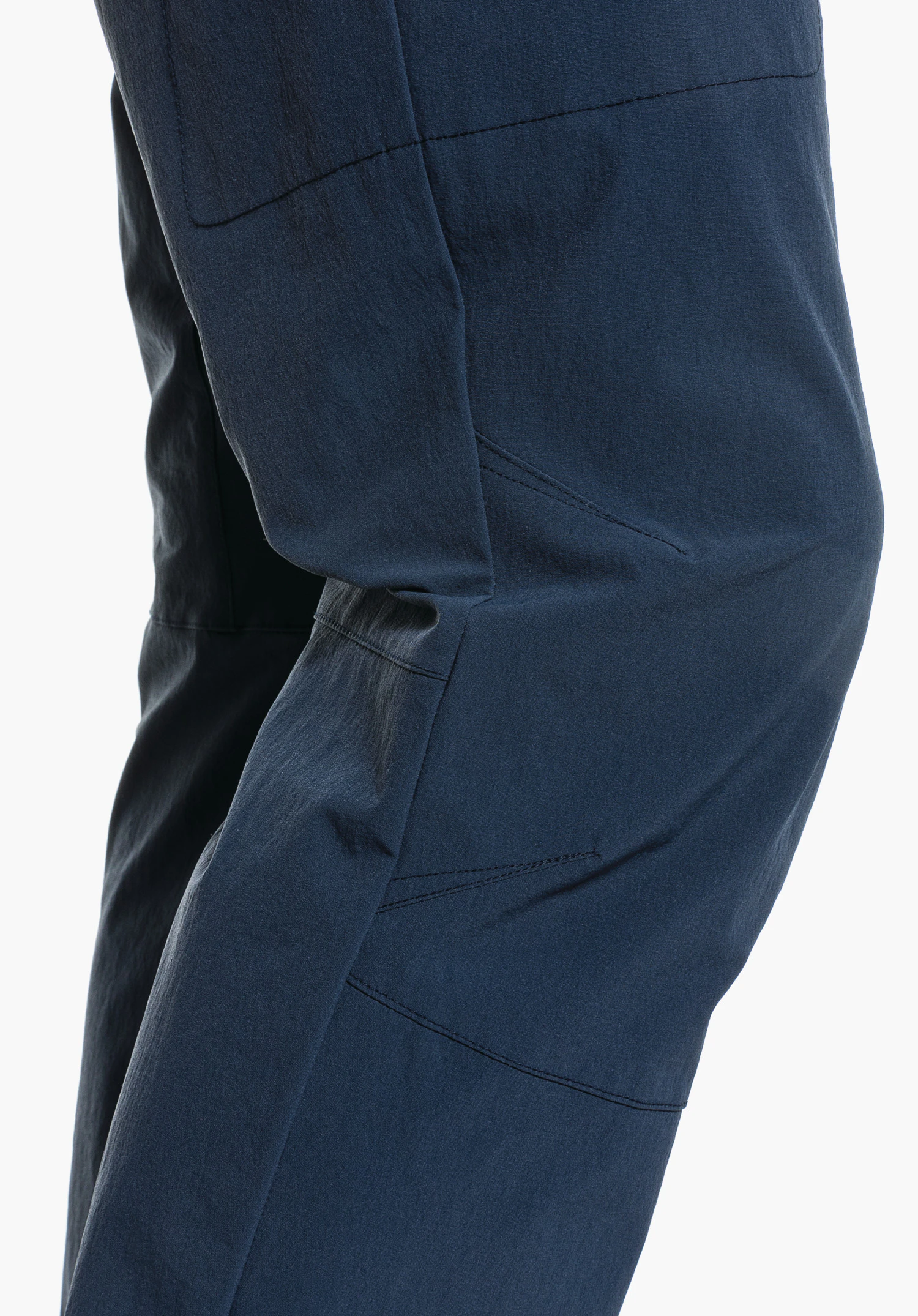 Pants Koper1 shows the pre-shaped knee section of the blue material in a close-up against a white background.