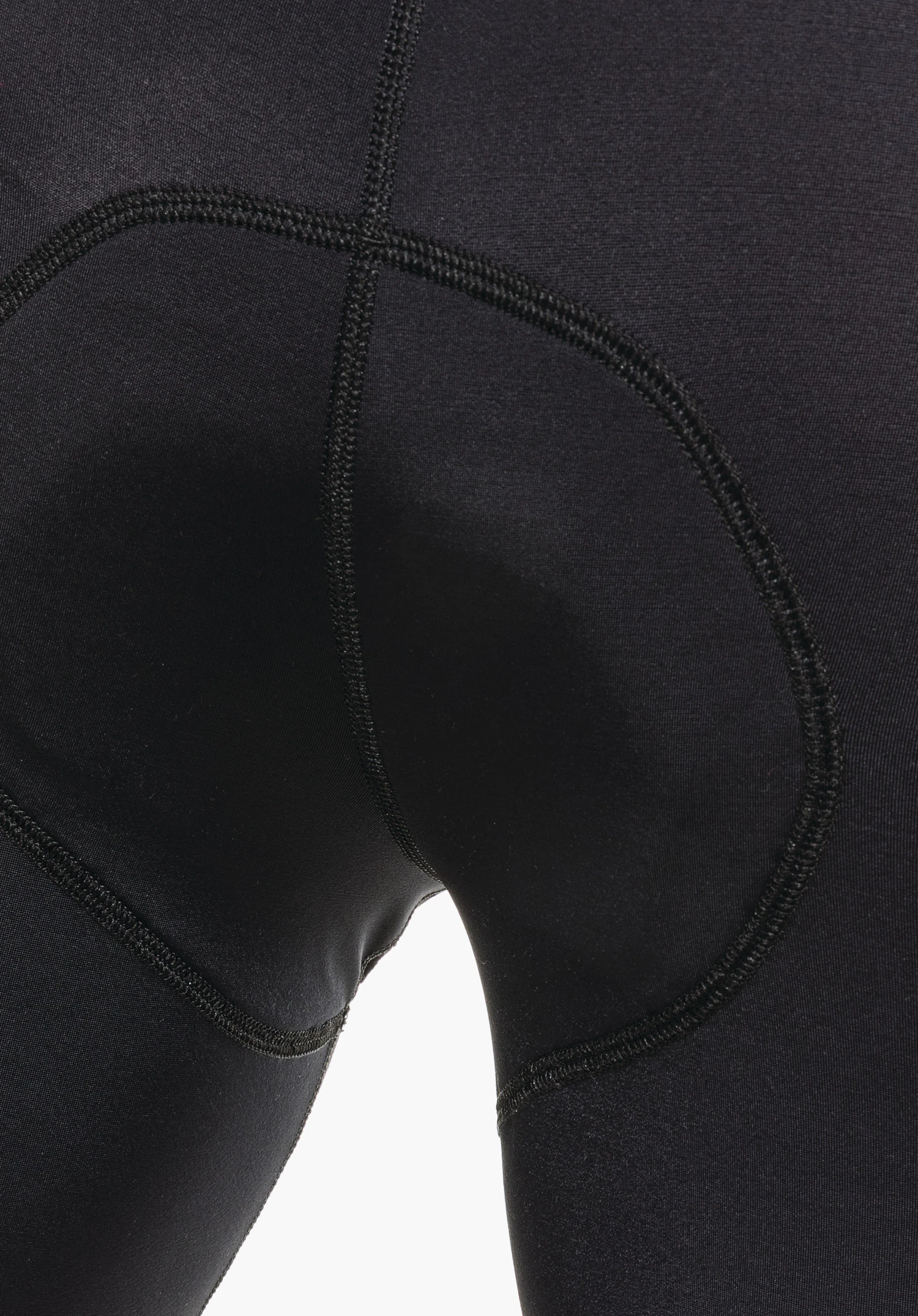 Skin Pants 8h M, detail view of the integrated seat pad structure in the black technical fabric, close-up against a white background.