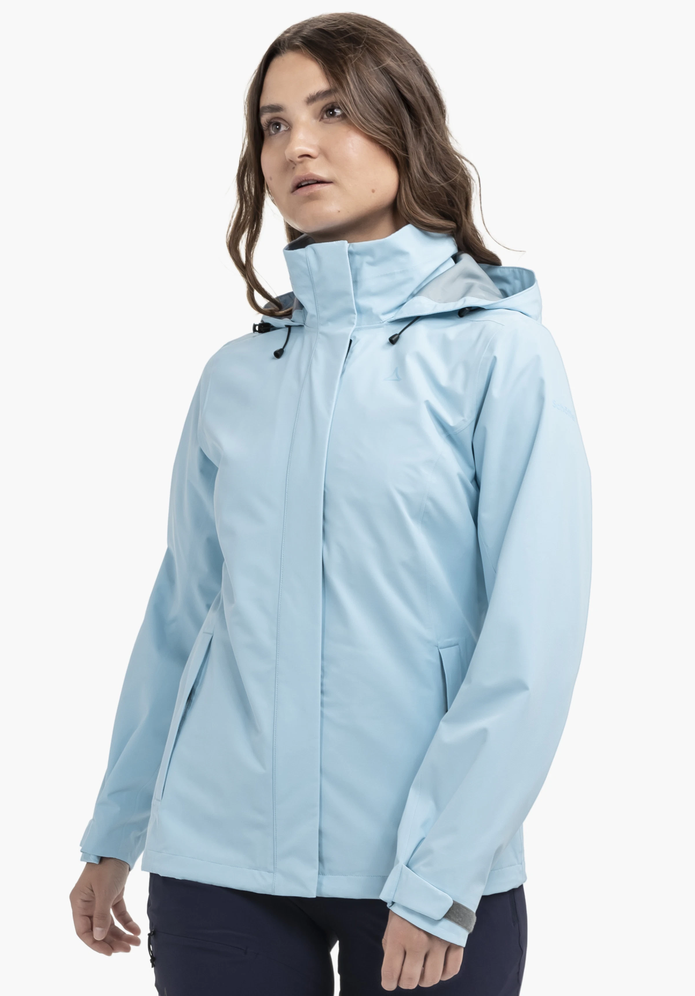 Jacket Gmund L en bleu, portée par un mannequin se tenant légèrement de côté. Le logo Schöffel est discrètement visible sur la poitrine gauche. L'image montre la veste portée sur un fond neutre.