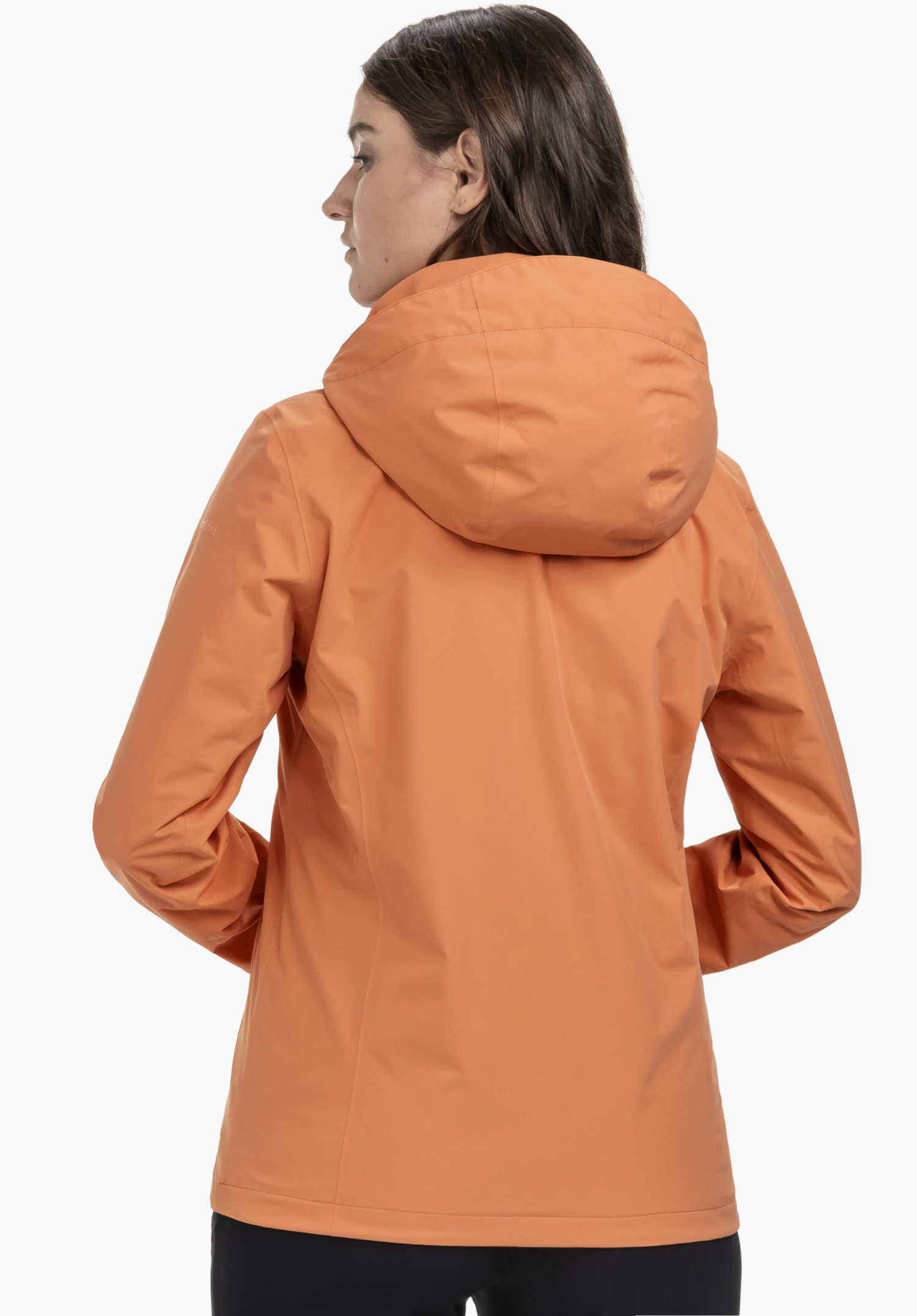 Jacket Gmund L in orange. A model wears the jacket in a back view, with her head turned to the left, set against a neutral background. The Schöffel logo is subtly visible on the left sleeve.