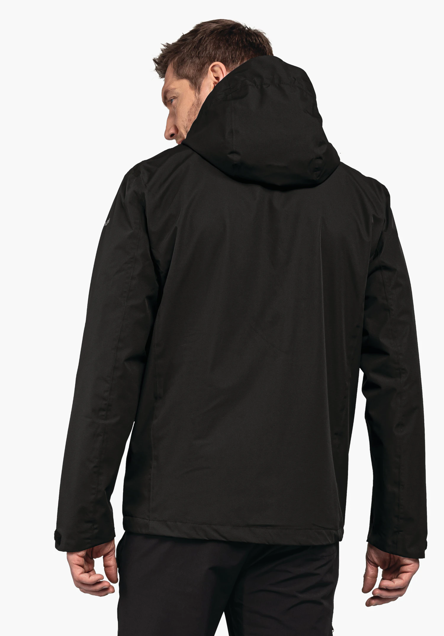 Jacket Gmund M black hooded jacket worn by a man showing his back and looking over his left shoulder; neutral white studio background.