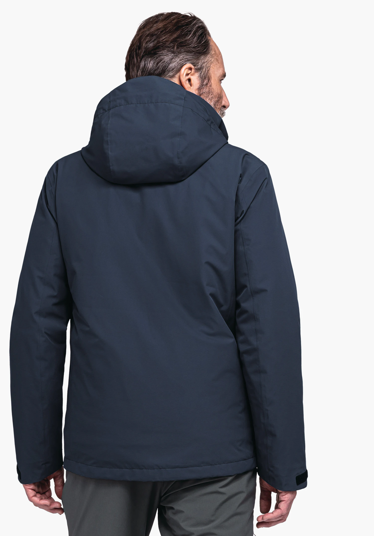 Jacket Gmund M dark blue jacket worn by a person in rear view, looking sideways; hood present, grey trousers; neutral white background.