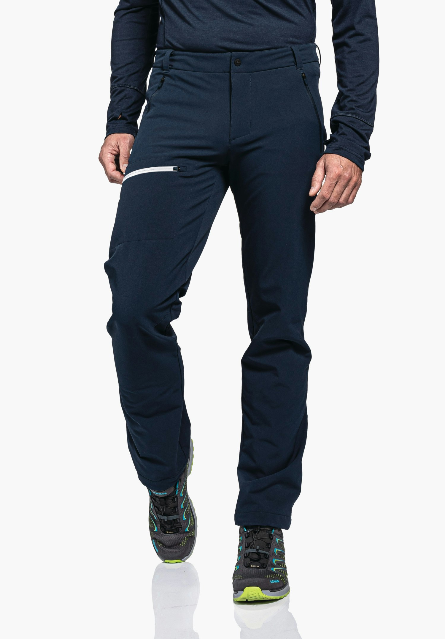 Pants Folkstone Warm M Dark blue outdoor trousers; person wears them while walking forward; side pocket with white zip; visible lower body on a white studio background; paired with sports shoes.