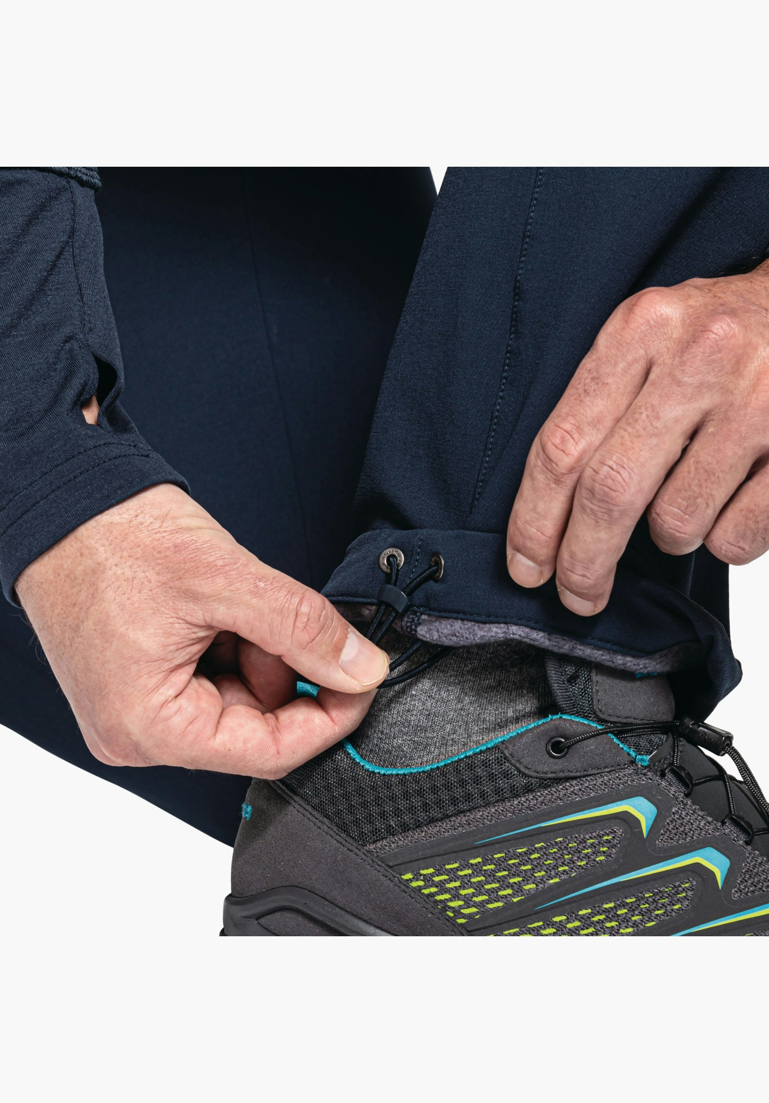 Pants Folkstone Warm M shows the adjustable hem with drawstring on the blue trouser leg, close-up against a white/neutral background.