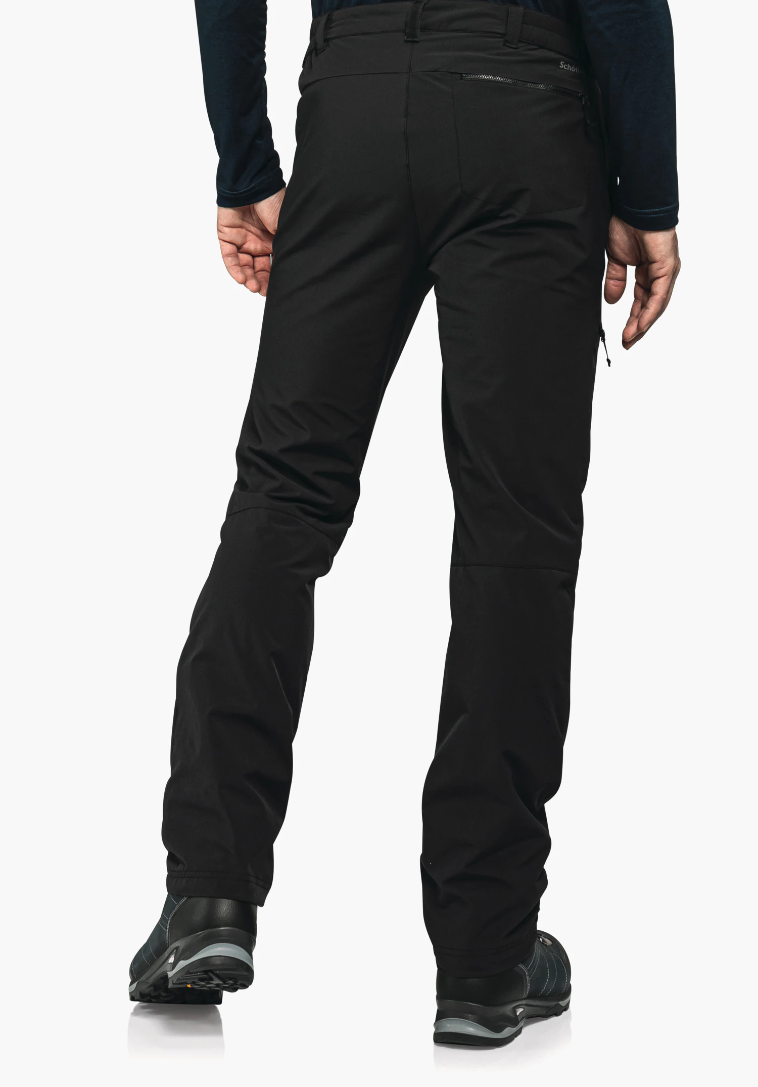 Pants Koper1 Warm M black outdoor trousers worn from the back; person wearing a dark blue top stands against a white background; “Schöffel” text on waistband pocket.
