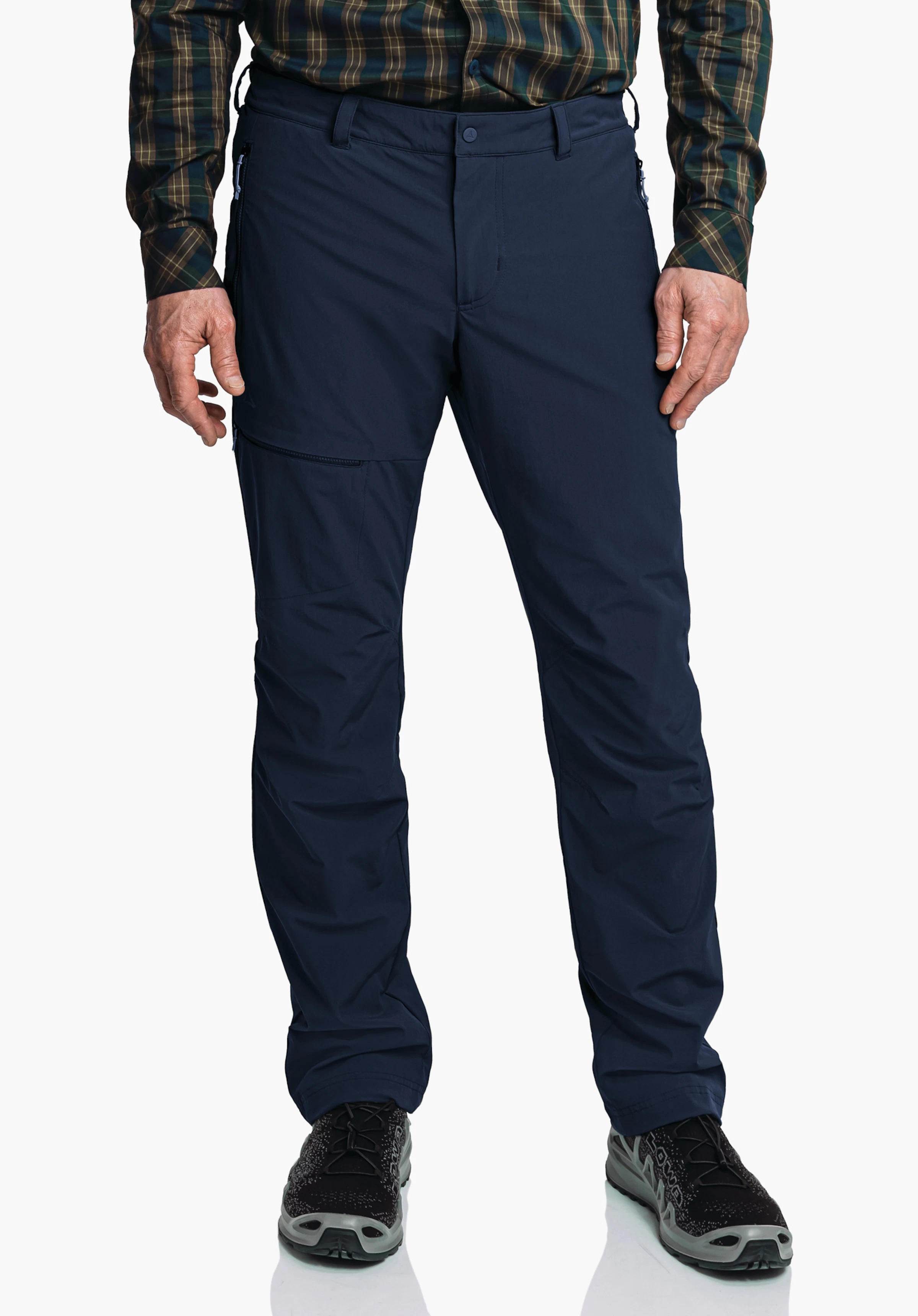 Pants Koper1 Warm M Dark blue outdoor trousers worn standing; person wears a dark green checked shirt and black hiking shoes; hands visible, neutral white background.