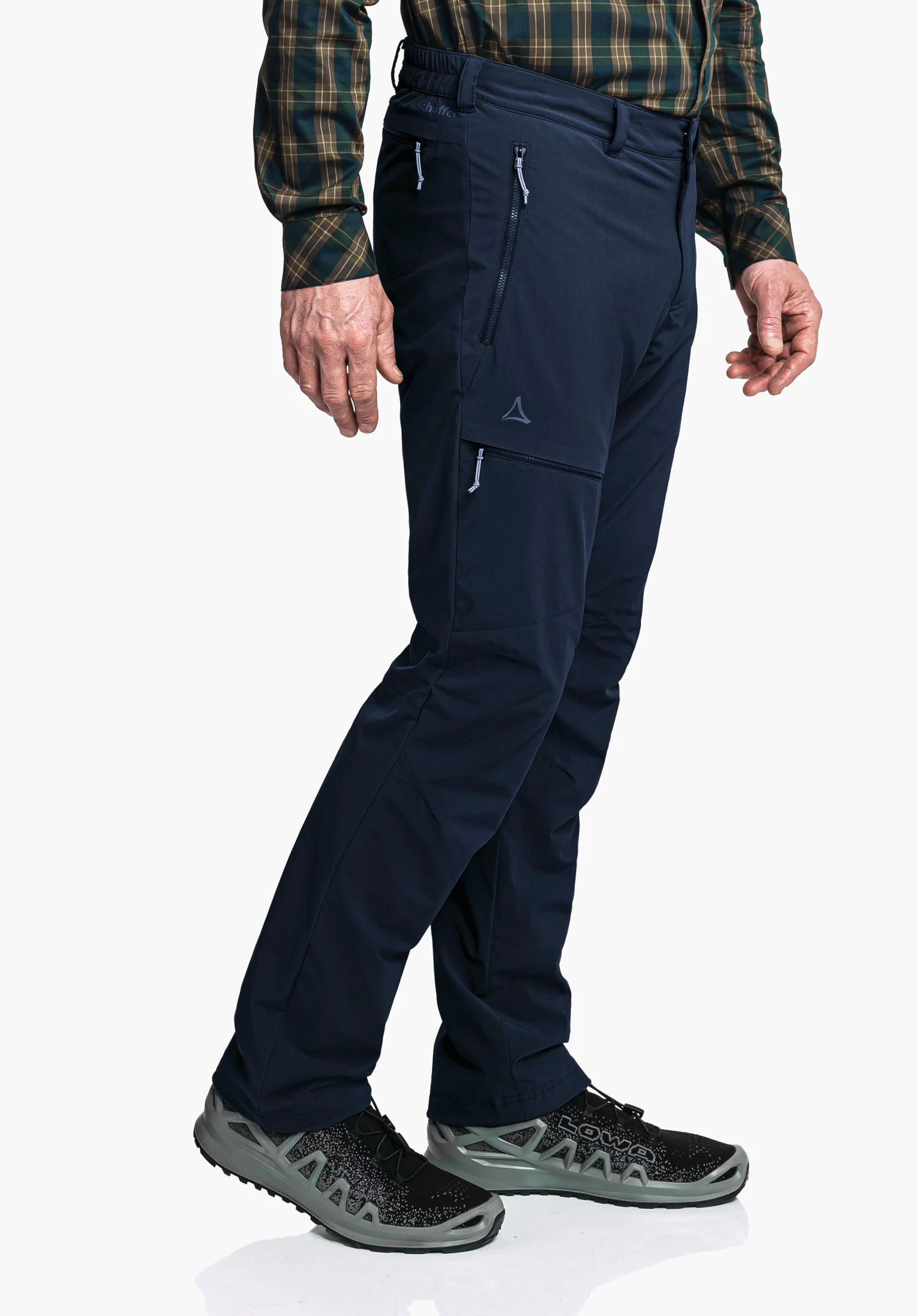 Pants Koper1 Warm M dark blue outdoor trousers shown side-on, worn by a person with a green-yellow checked shirt; Schöffel logo on the thigh. Visible text: "schöffel", "LOWA".