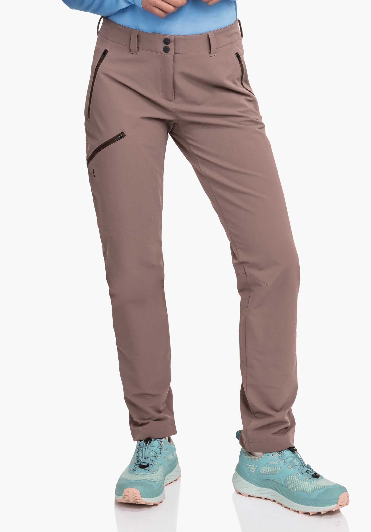 Pants Ascona Warm L dark brown outdoor trousers, standing with legs slightly apart, zip pockets on the thigh, visible Schöffel logo; context: white studio setting, light blue outerwear and light blue hiking shoes.