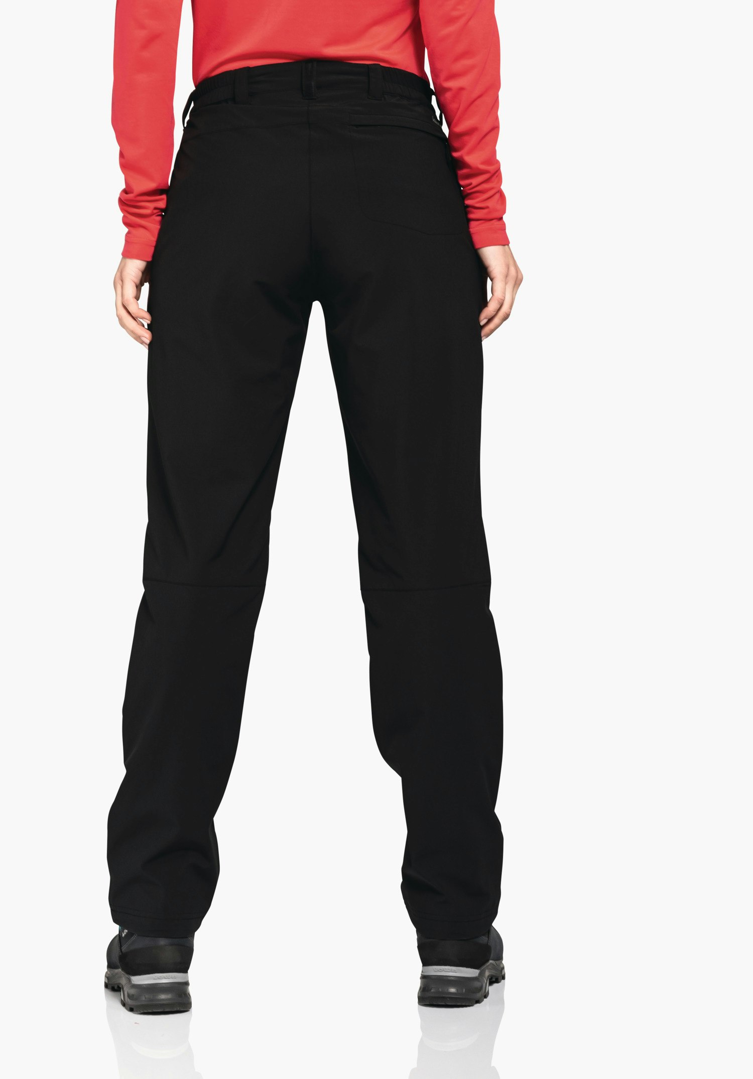 Pants Engadin1 Warm L black trousers worn from the back; person stands with hands at the sides, red top, black hiking shoes; neutral white background.