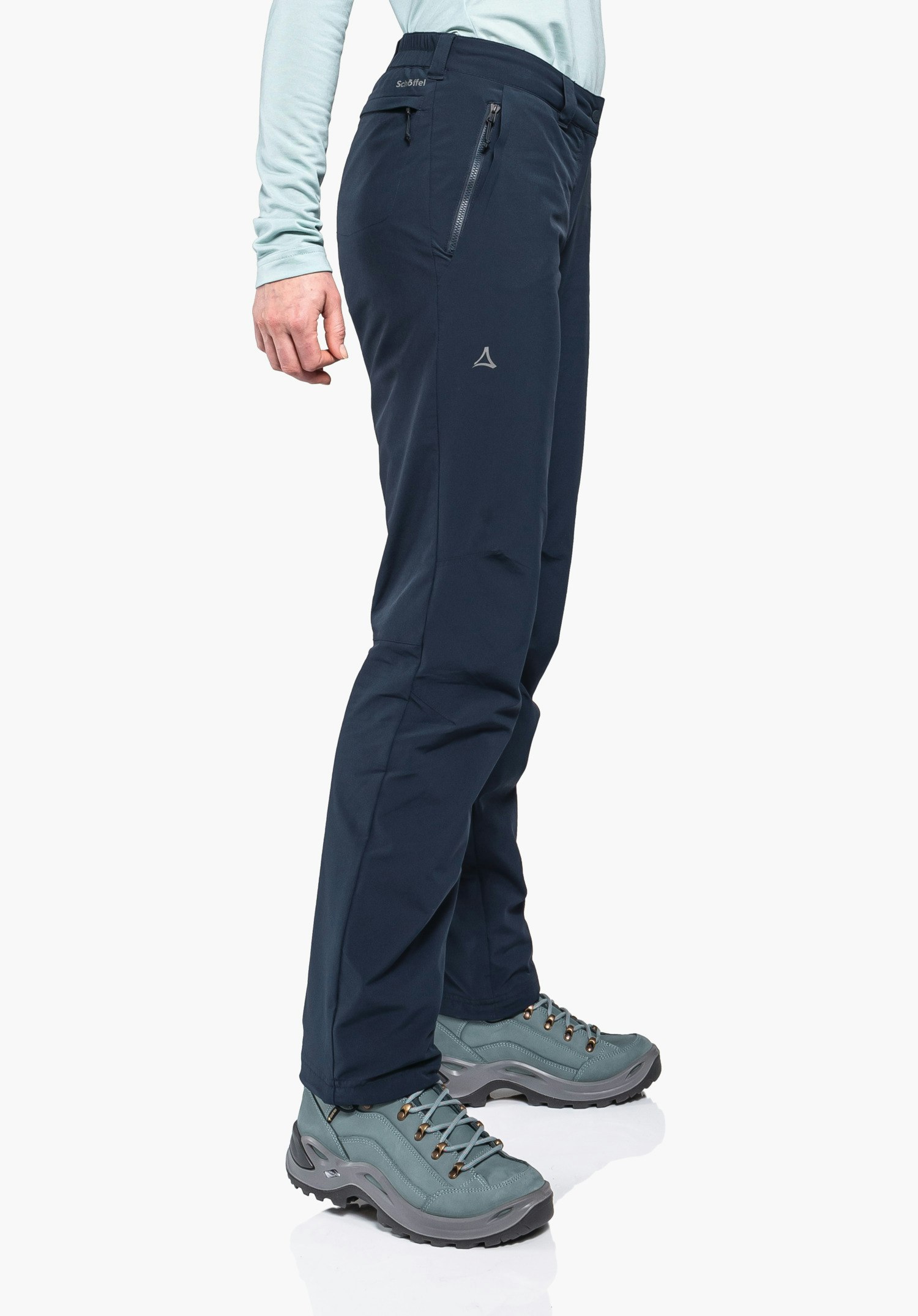 Pants Engadin1 Warm L displays the side pocket zip and the Schöffel logo on the blue technical fabric. Close-up against a white/neutral background.