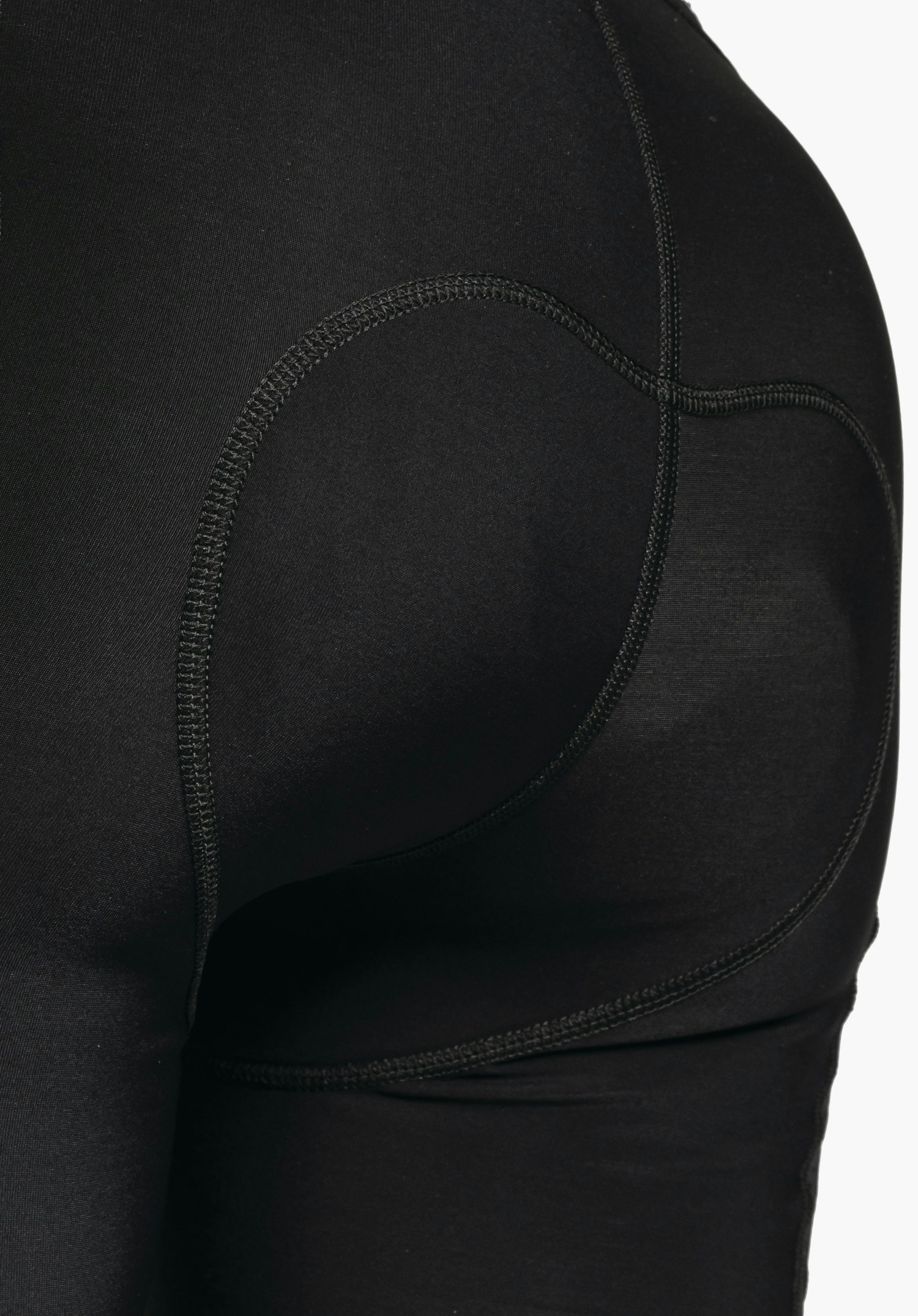 Skin Pants Warm 4h L, vue détaillée de la taille élastique et de la structure fonctionnelle du tissu en noir, gros plan sur fond blanc/neutre.