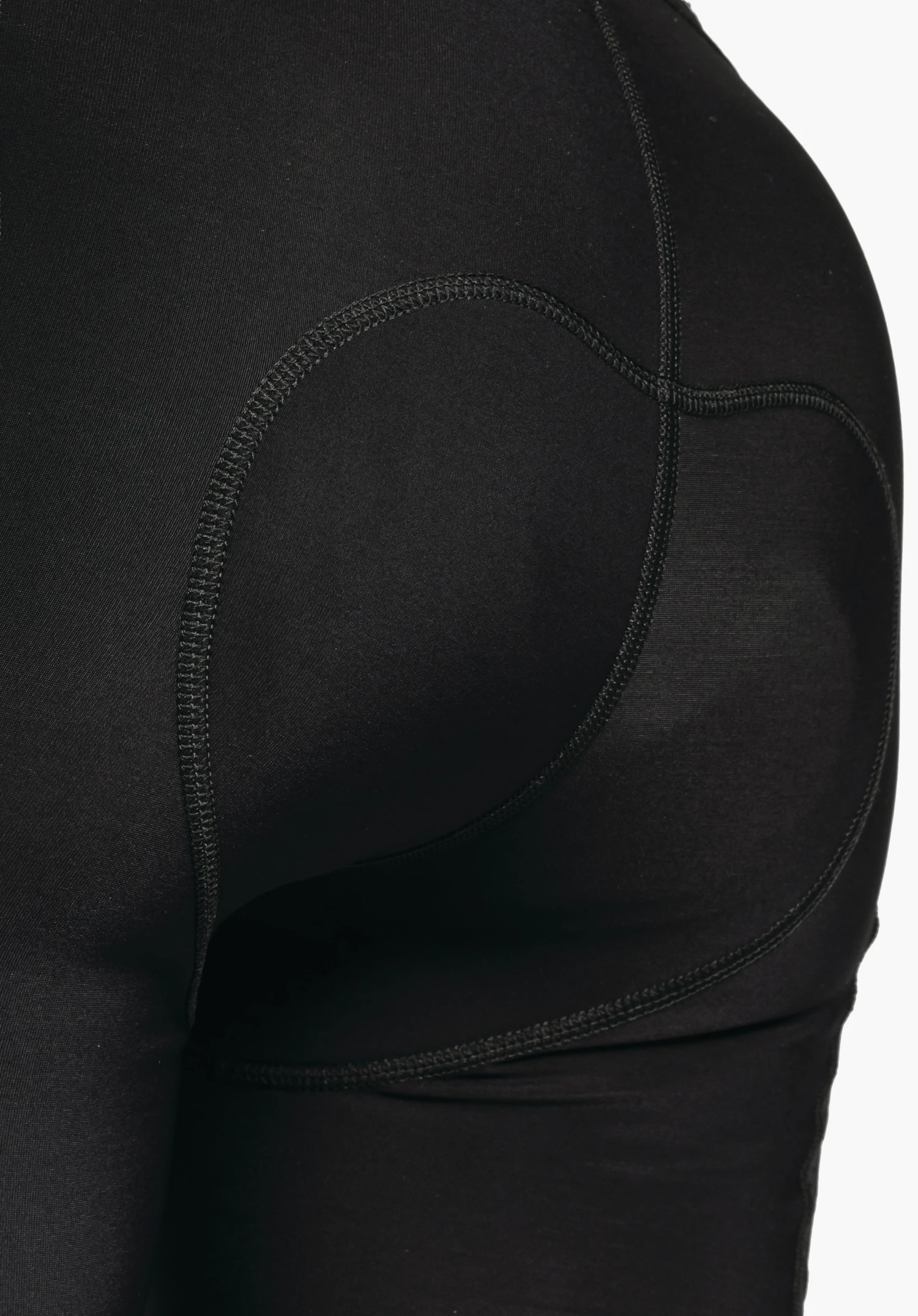 Skin Pants Warm 4h L, vue détaillée de la taille élastique et de la structure fonctionnelle du tissu en noir, gros plan sur fond blanc/neutre.