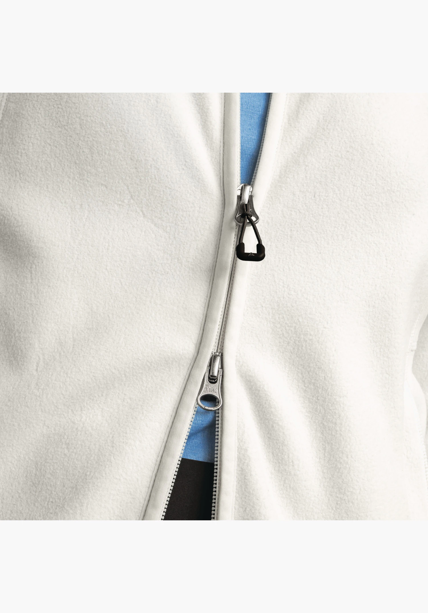 Fleece Jacket Leona3: The practical two-way zip with easy-grip puller on the soft natural fleece. Close-up against a white background.
