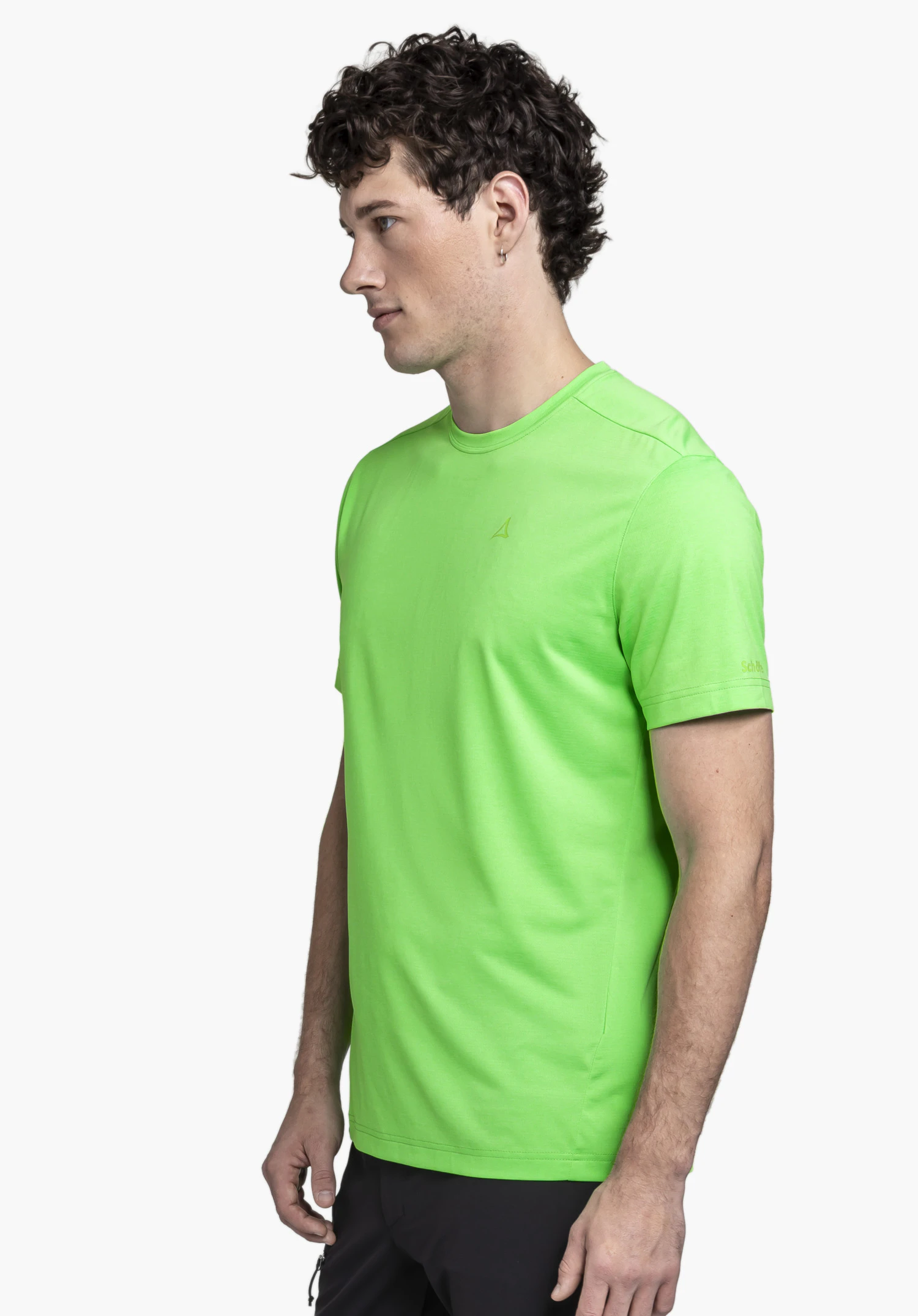 CIRC T Shirt Tauron M on a model standing sideways. You can see the green shirt with the subtle Schöffel logo on the chest against a neutral background.
