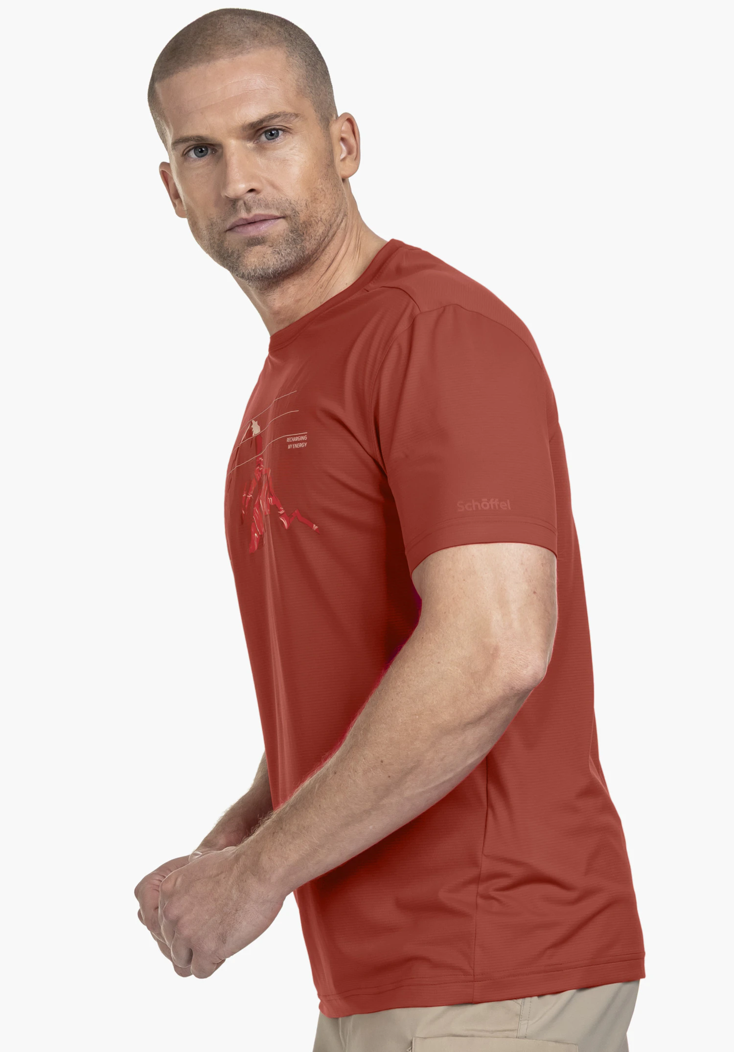 CIRC T Shirt Sulten M in red, worn by a model in front of a neutral background. The model is standing sideways and looking directly into the camera, showcasing the detailed front print and the subtle Schöffel logo on the sleeve.