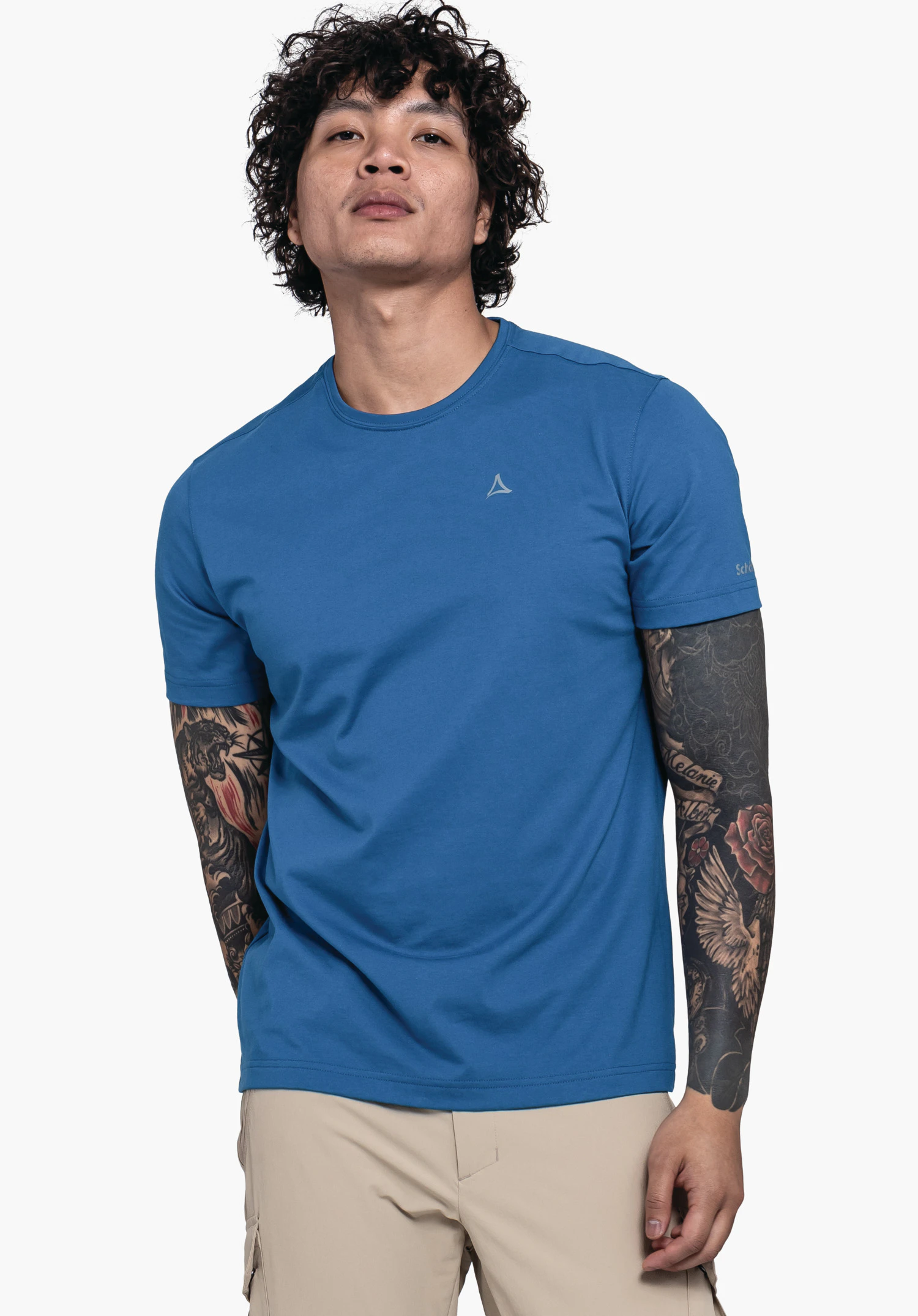 T Shirt Hohberg M in blue. The model is standing in a frontal pose against a neutral background, wearing the shirt with a classic crew neck. The subtle Schöffel logo is visible on the chest and the sleeve.
