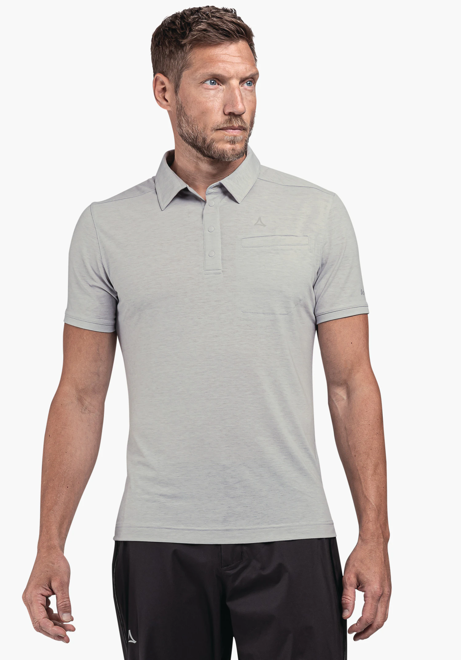 Polo Shirt Ramseck M: A male model wears the polo shirt in grey, posing frontally against a neutral background. The subtle Schöffel logo is visible on the chest, highlighting the sporty yet elegant appearance.