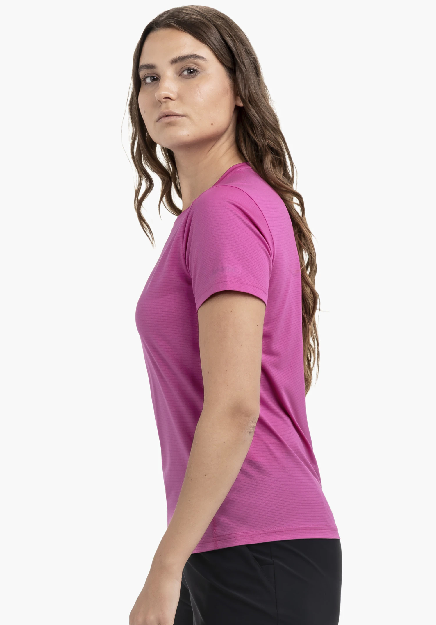 CIRC T Shirt Tauron L in pink. The model is standing sideways against a neutral background, showcasing the T-shirt in a vibrant pink tone. The Schöffel logo is subtly visible on the sleeve.