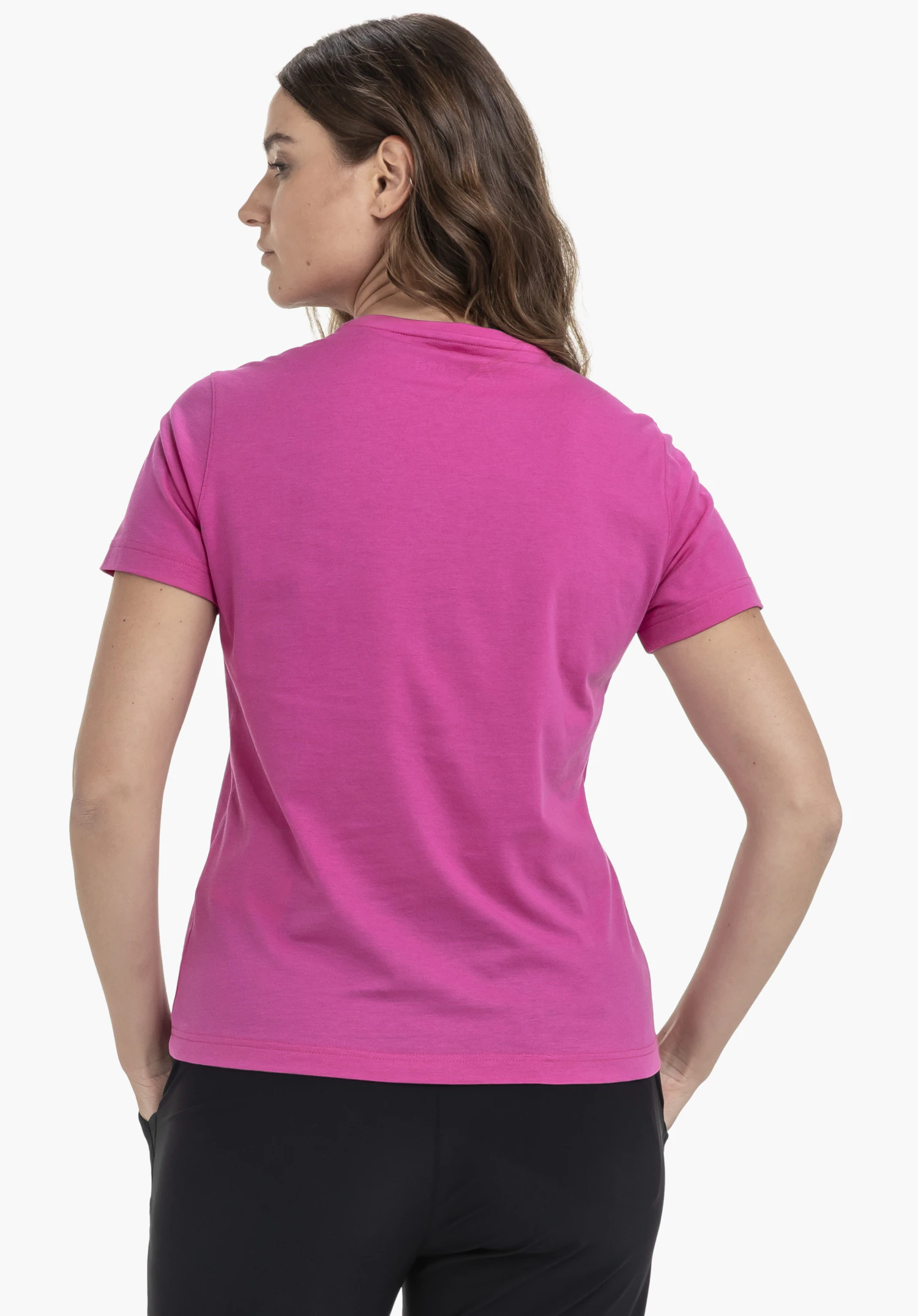 T Shirt Hohberg L in the colour pink, worn in a back view by a model. The t-shirt is paired with black trousers and presented against a neutral background.