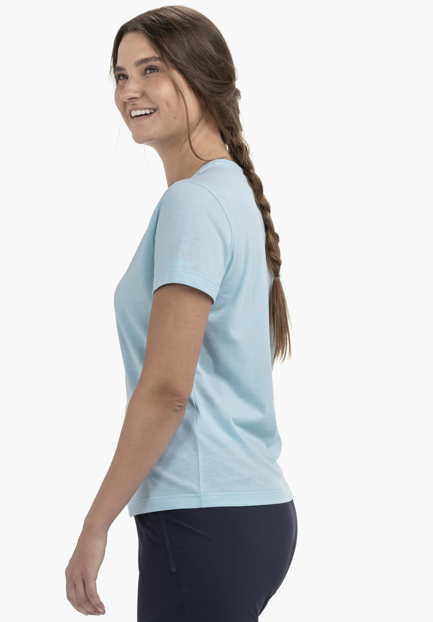 T Shirt Hohberg L in blue worn by a model standing sideways, displaying the Schöffel logo on the sleeve, photographed against a neutral background.