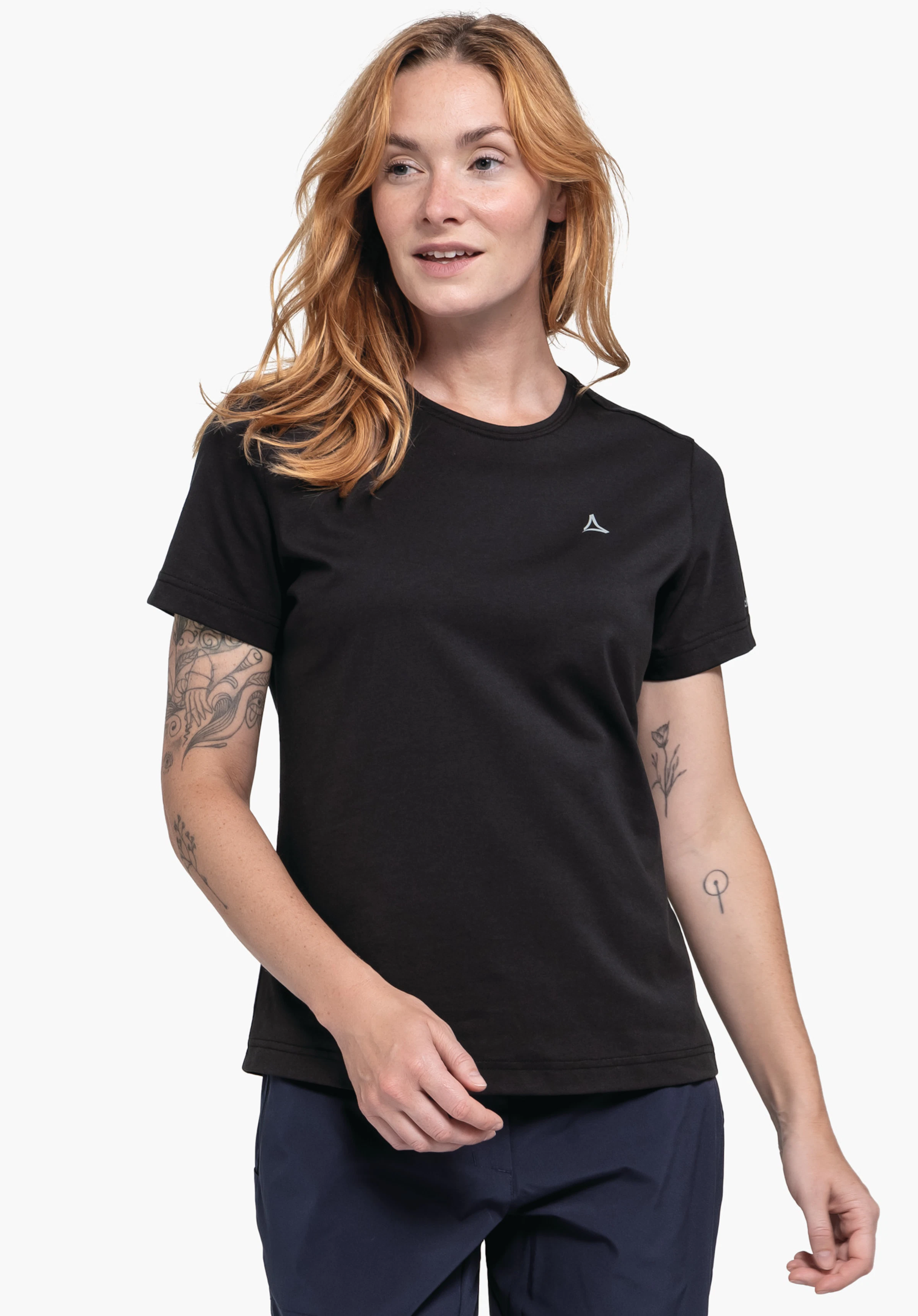 T Shirt Hohberg L on a model standing facing forward, wearing the black t-shirt. The Schöffel logo is visible on the left chest, photographed against a neutral background.