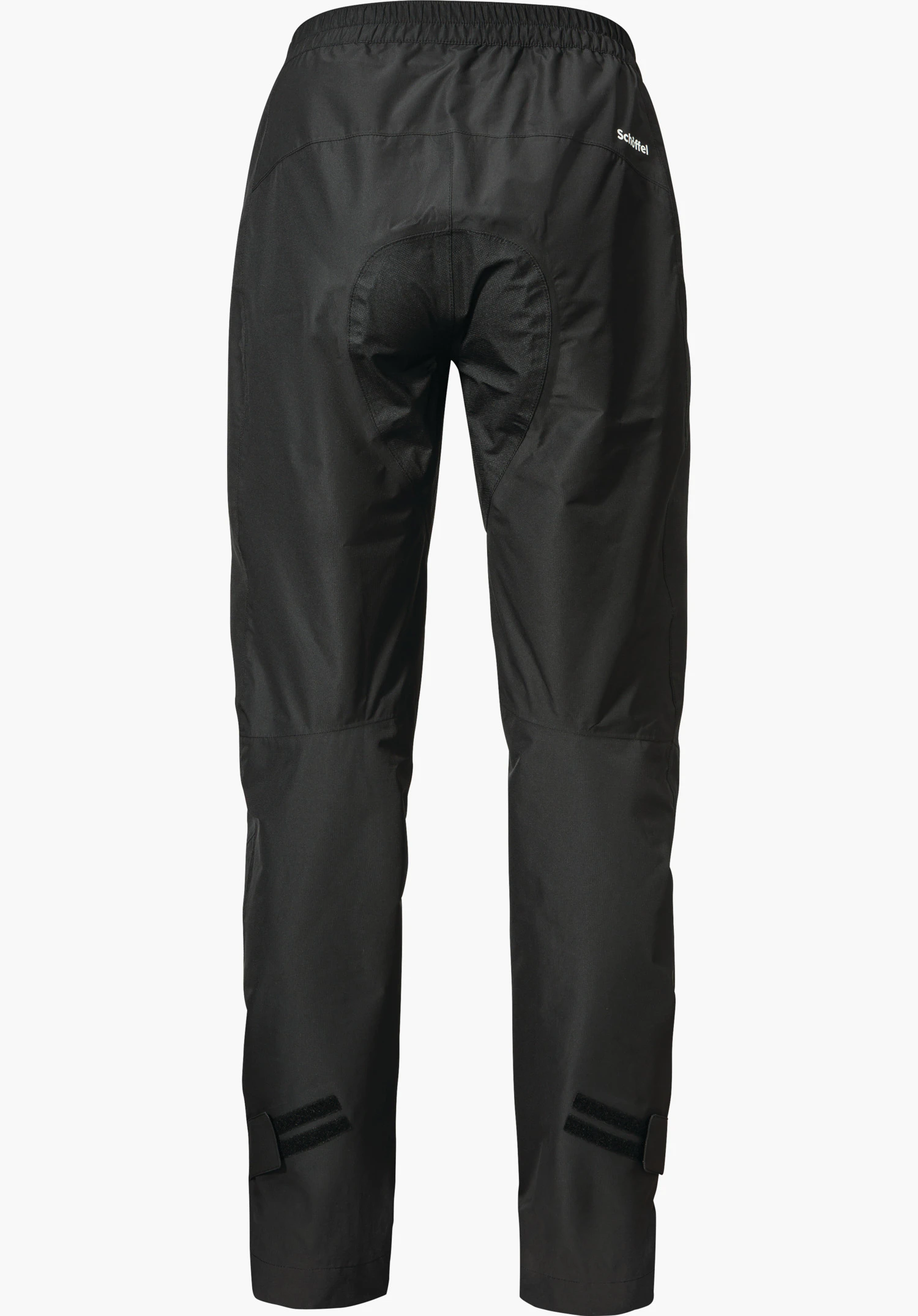 2.5L Pants Tarvis L black rain trousers, rear view; showing padded seat area and Velcro fastenings at the legs; cut out on a white background. Text: “Schöffel”.