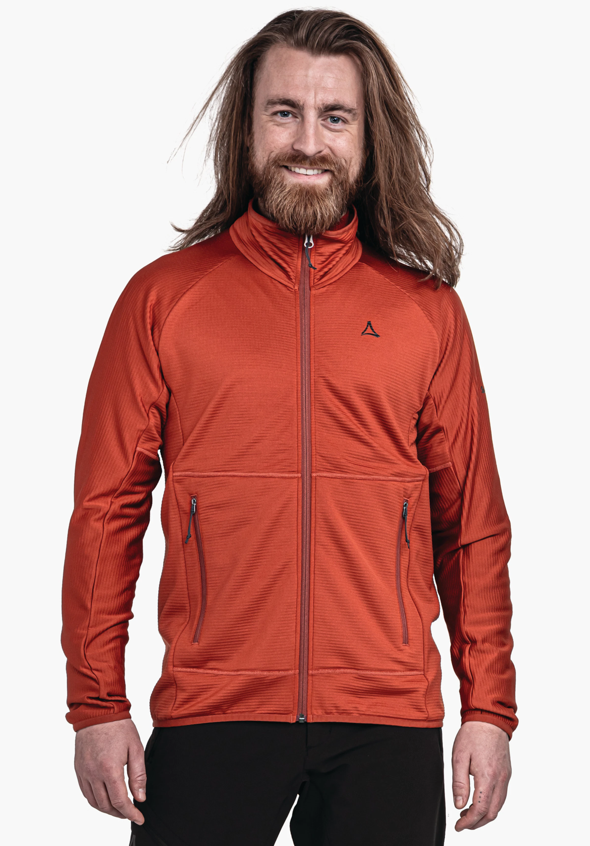 Fleece Jk Style Cascata MNS Mann trägt rote Reißverschlussjacke, lächelt und steht frontal vor weißem Hintergrund; Schöffel-Logo auf linker Brust sichtbar.