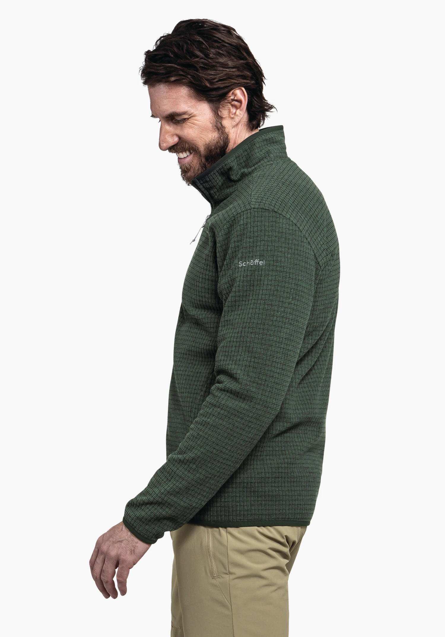CIRC Fleece Jk Style Terxa MNS dark green jacket; man smiles and looks downwards, arm relaxed, standing in front of a white background. Text on sleeve: "Schöffel".