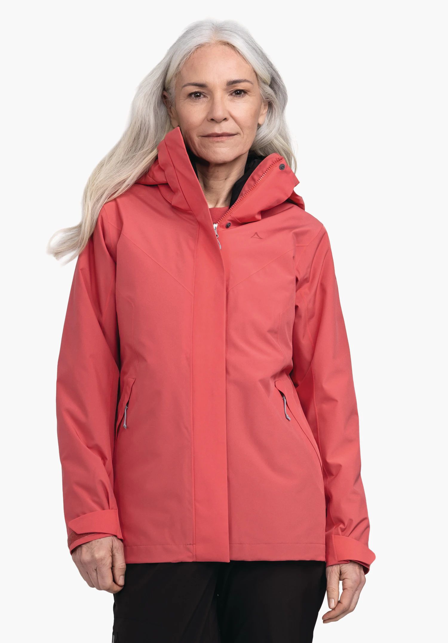 3in1 Jacket Style Tamina WMS pink jacket with Schöffel logo on the front; worn by a smiling woman with one hand slightly raised; neutral white background. Text on sleeve: Schöffel.