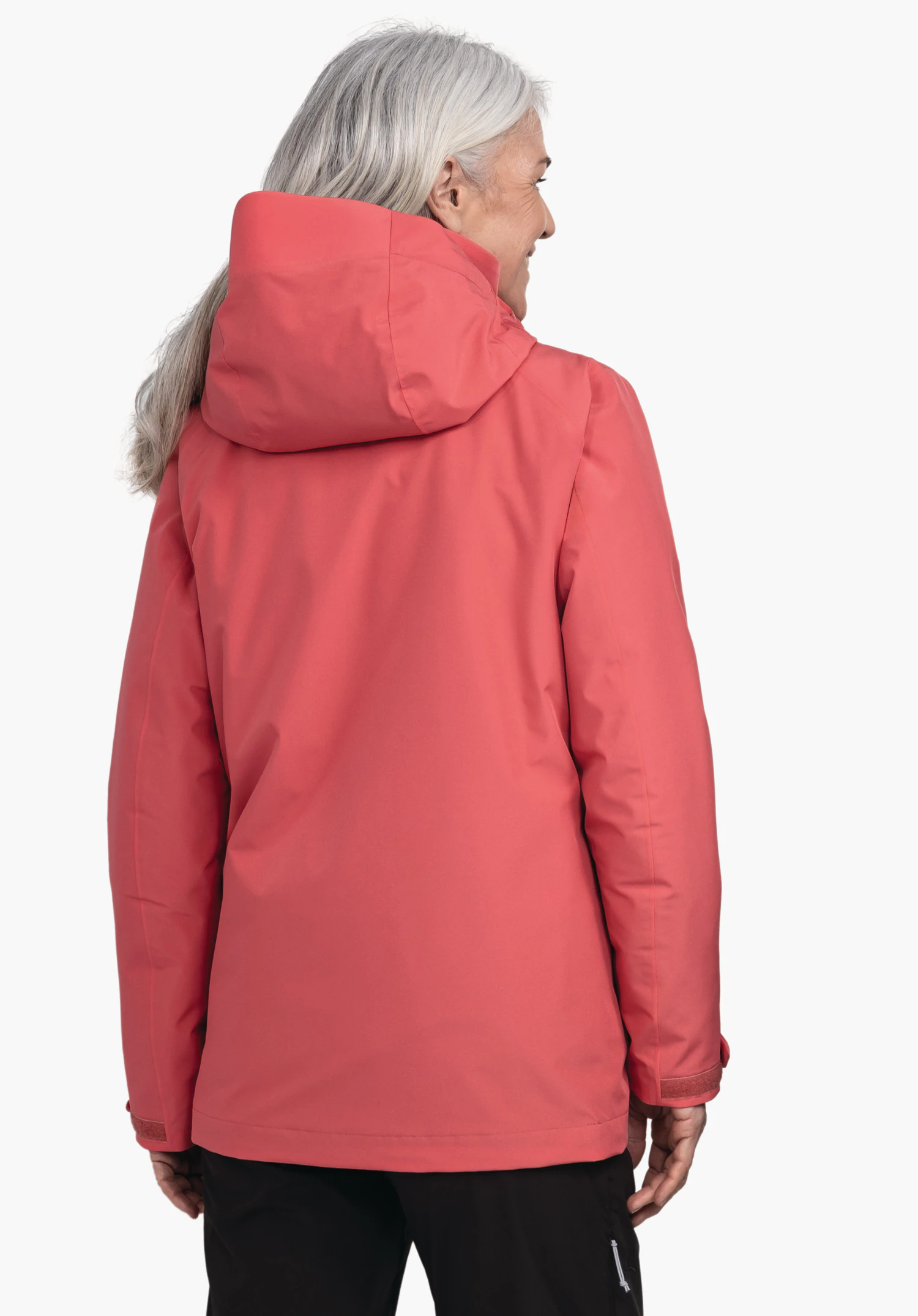 3in1 Jacket Style Tamina WMS light red jacket worn by an older woman standing with her back to the camera and turning her head right; white background, black trousers.
