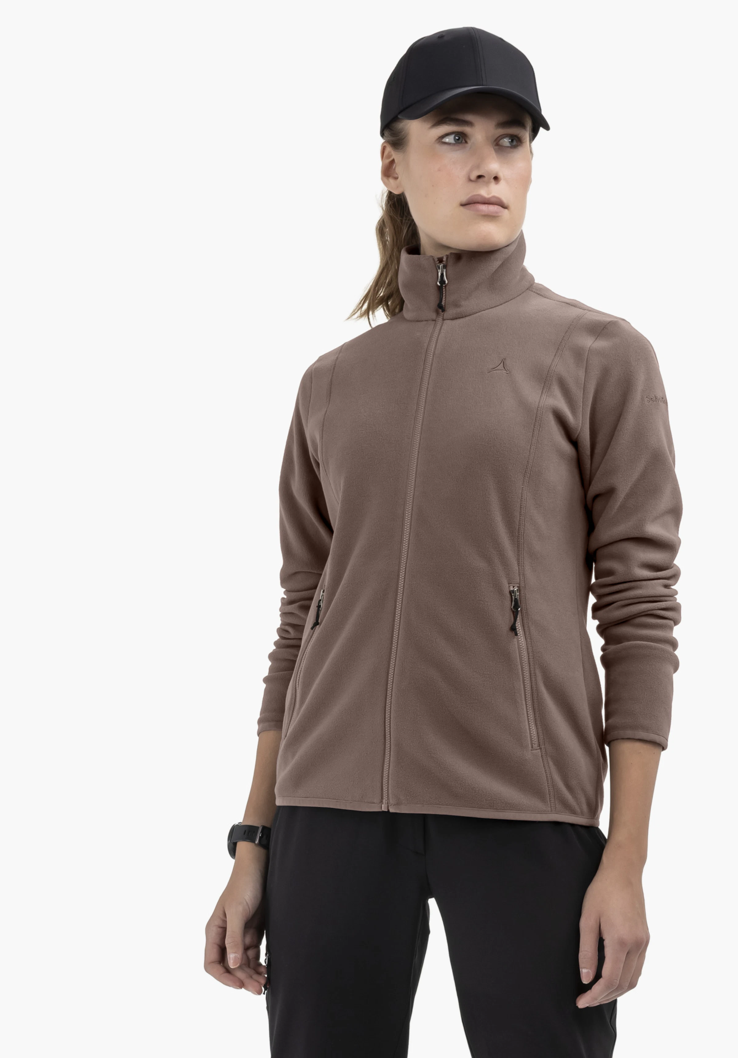 Fleece Jk Style Ash WMS worn by a model standing slightly to the front. The closed brown jacket with the Schöffel-Logo on the left chest is shown against a neutral background.