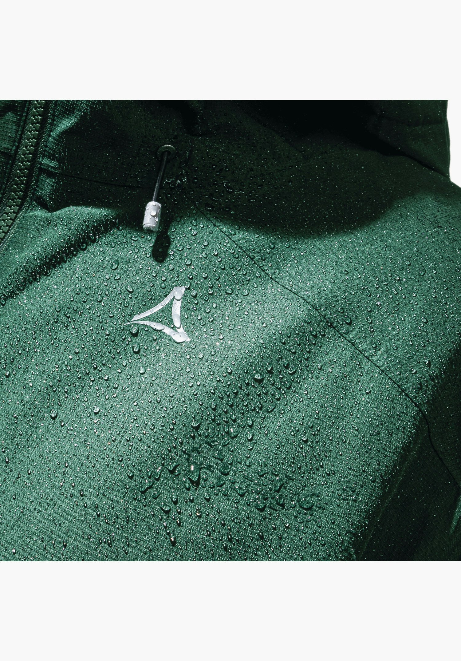 Ins Jacket Style Wildkar MNS, showing the water-repellent green fabric with droplets and the Schöffel logo on the chest, close-up shot against a white/neutral background.