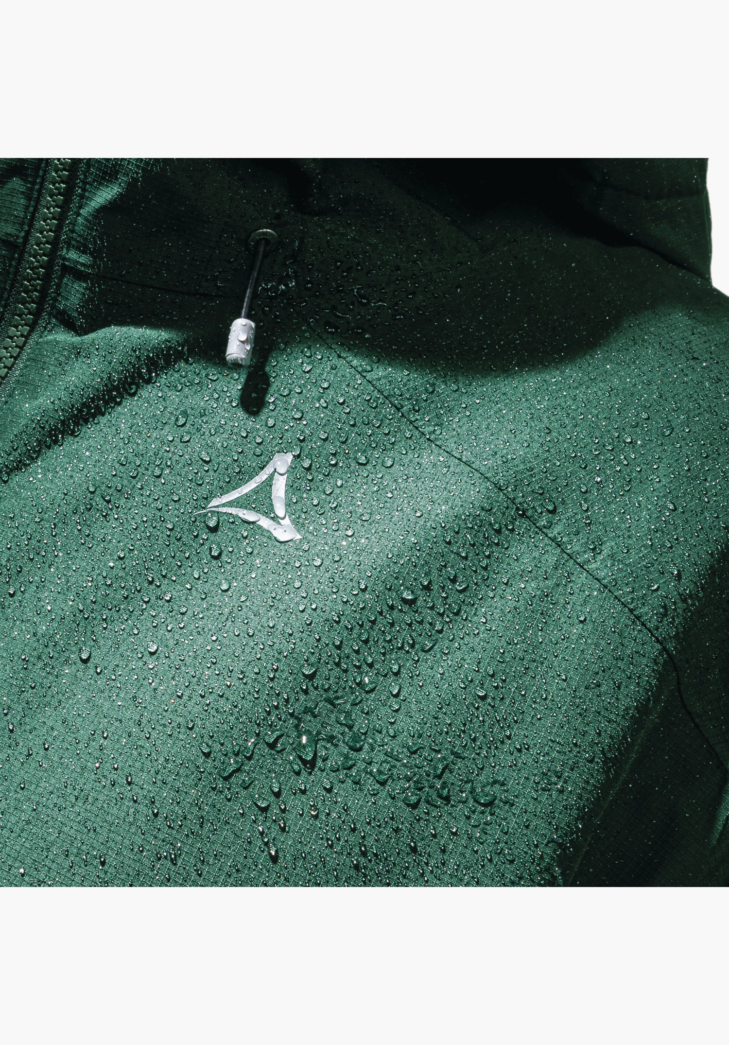 Ins Jacket Style Wildkar MNS, showing the water-repellent green fabric with droplets and the Schöffel logo on the chest, close-up shot against a white/neutral background.