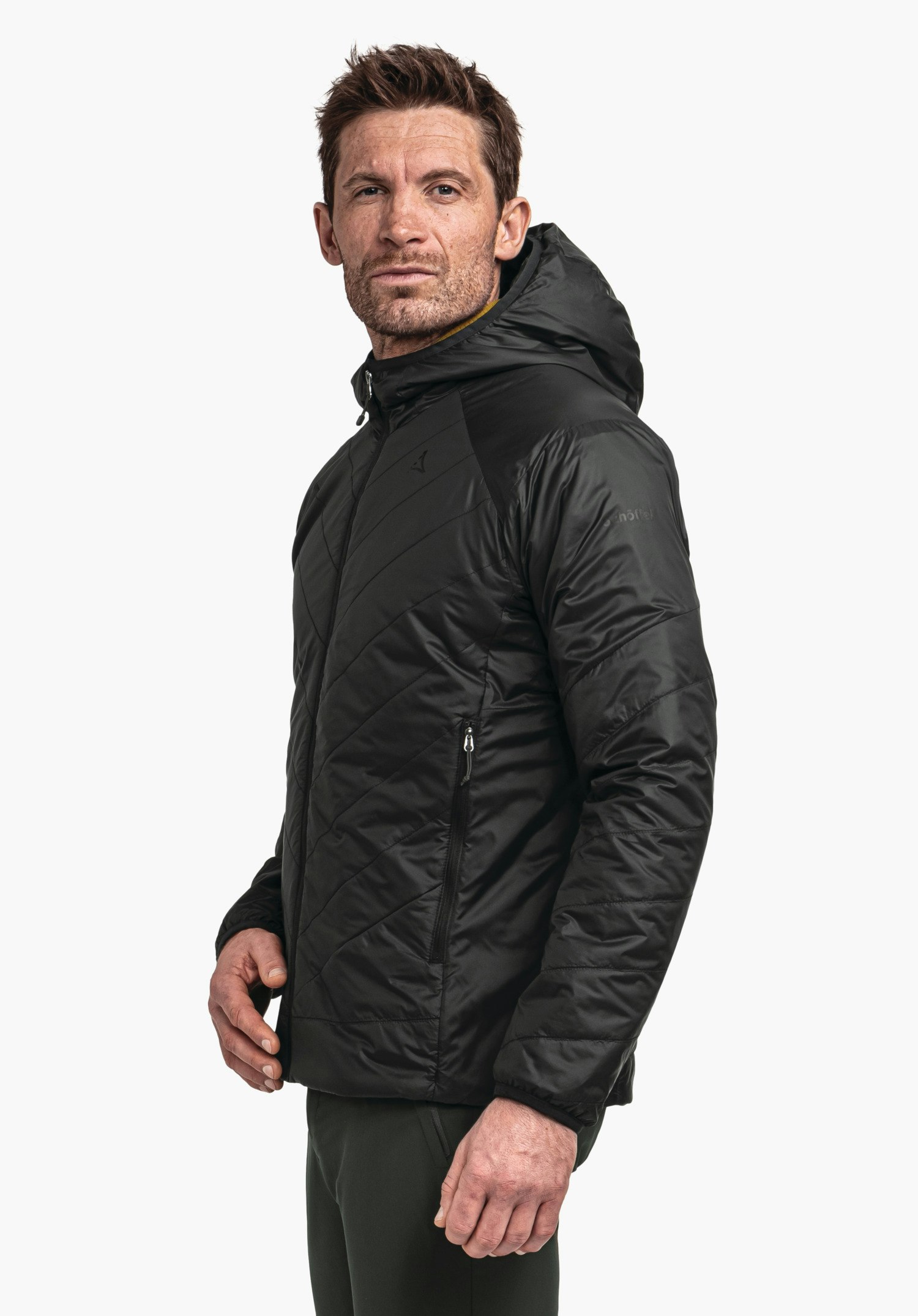 Ins Jacket Style Cascata MNS dark green quilted hooded jacket worn by a person standing side-on; Schöffel logo on the chest; white background.