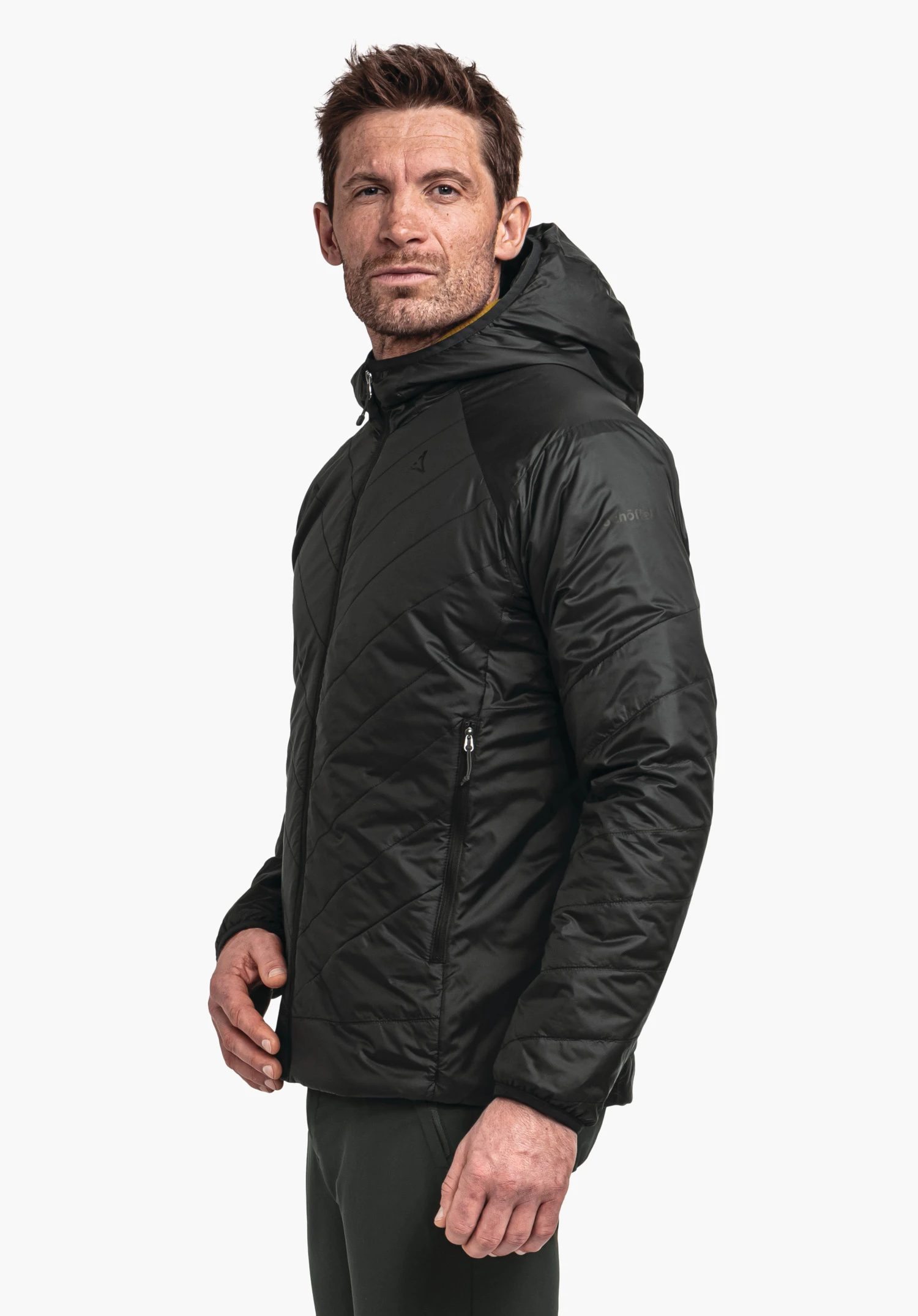 Ins Jacket Style Cascata MNS dark green quilted hooded jacket worn by a person standing side-on; Schöffel logo on the chest; white background.