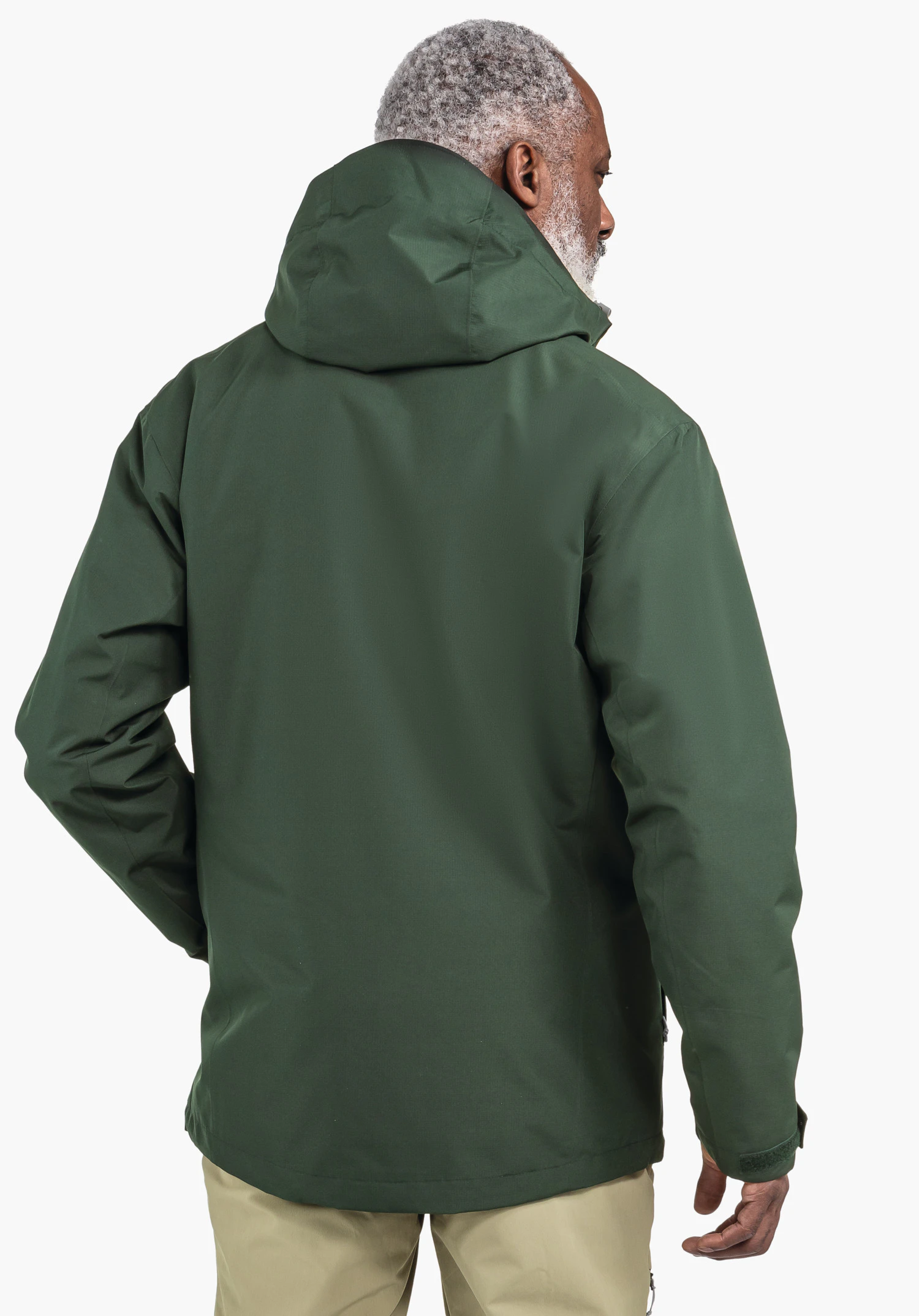 3in1 Jacket Style Okere MNS dark green jacket worn by a person standing with their back to the camera and turning the head to the right; neutral light background.