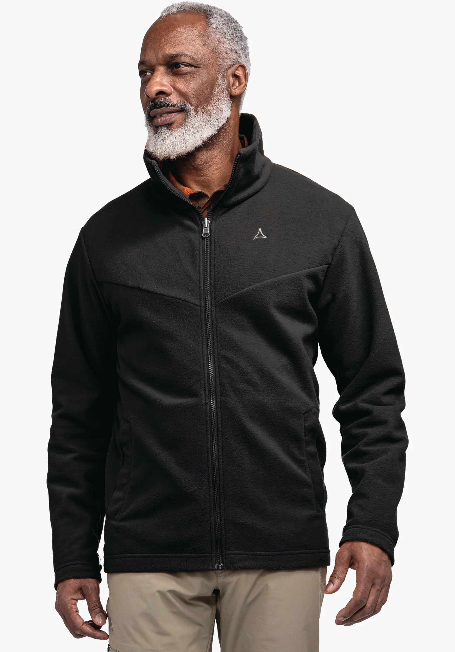 3in1 Jacket Style Okere MNS black jacket, worn by a man looking sideways; Schöffel logo on the chest; bright white background.
