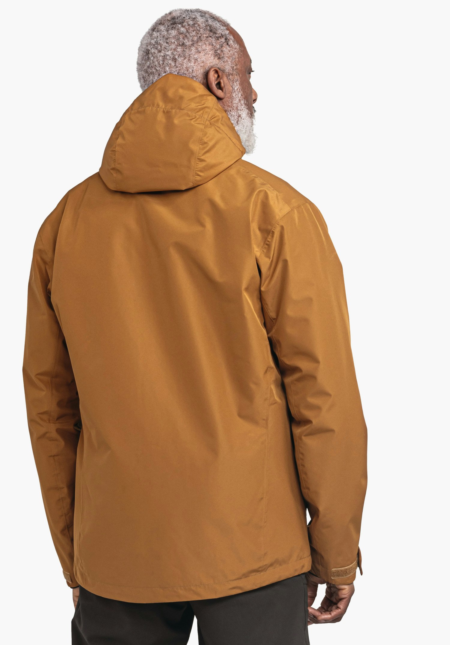 3in1 Jacket Style Okere MNS dark orange jacket worn by a standing person with hood up; back to the camera, person looks sideways; white background.