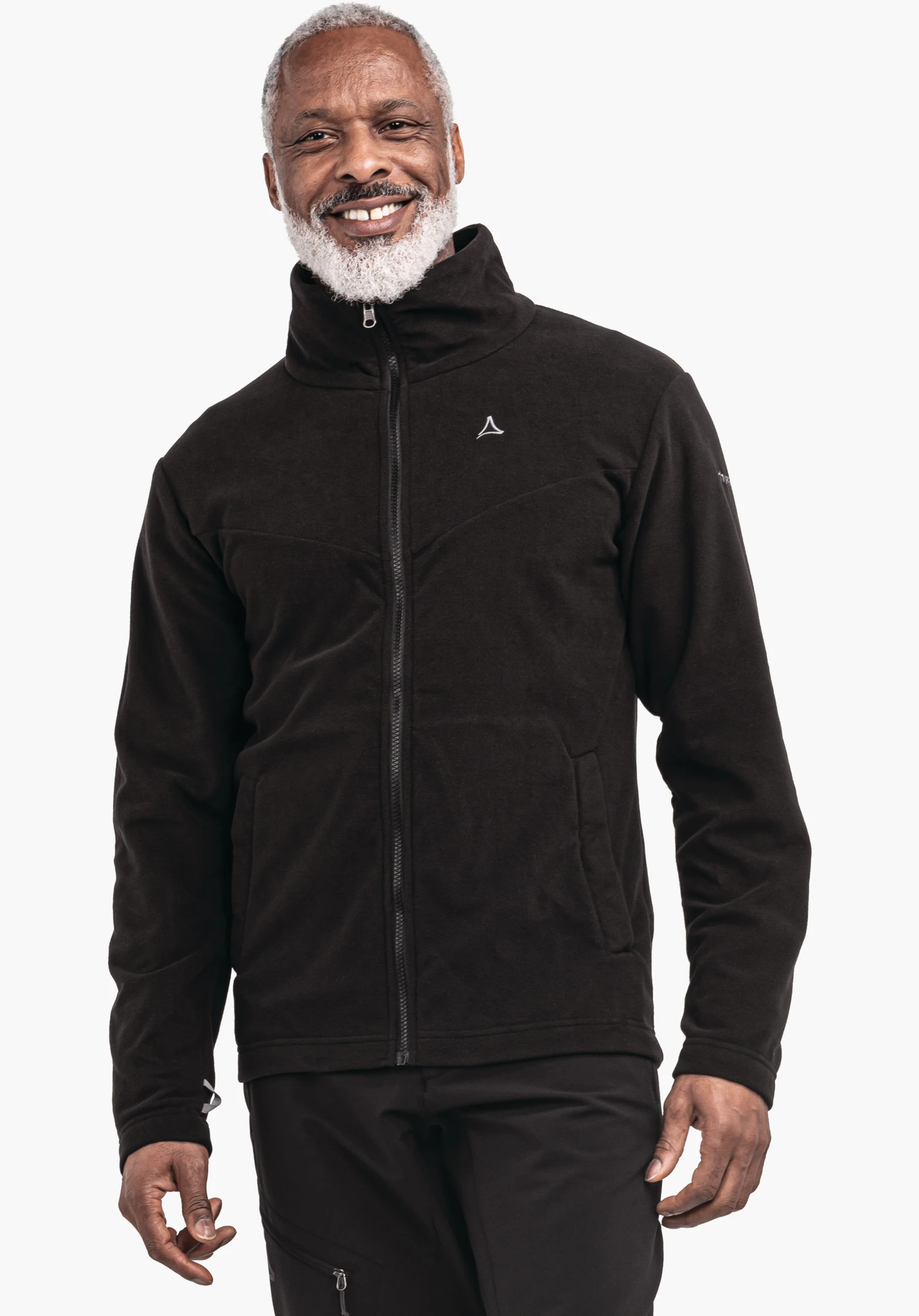 3in1 Jacket Style Okere MNS deep black fleece jacket with Schöffel logo; worn by a smiling man standing front-facing, hands relaxed at the sides; neutral light background.