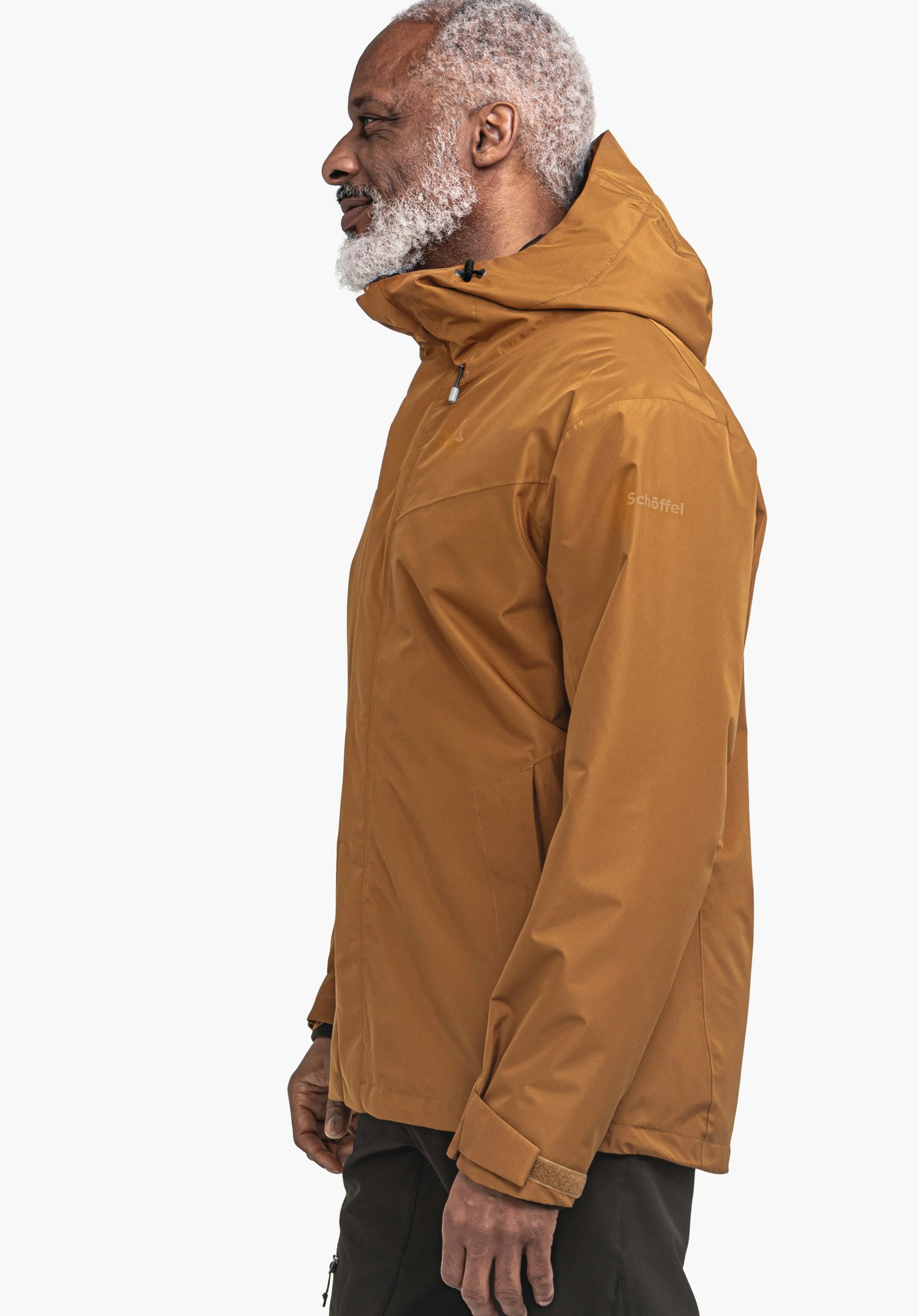 3in1 Jacket Style Okere MNS dark orange jacket worn by a standing man in profile, hood raised; white background. Text on sleeve: "Schöffel".