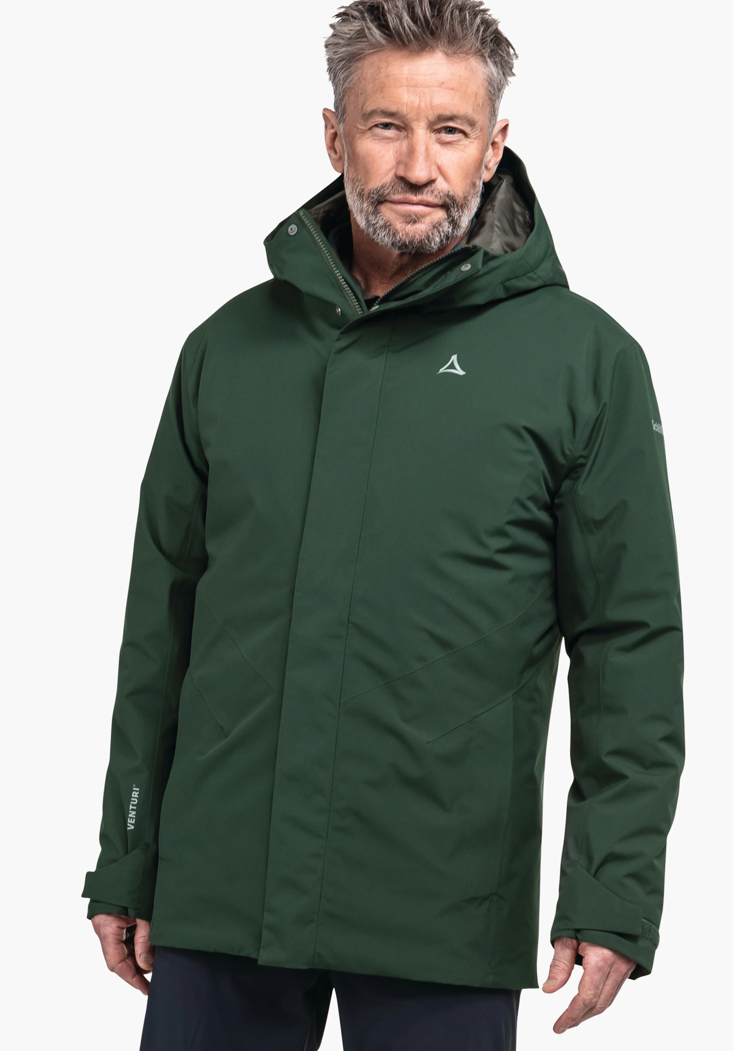 Parka Style Froda MNS Dunkelgrüne Kapuzenjacke, getragen von einem älteren Mann, steht frontal vor hellem Hintergrund; zeigt Schöffel-Logo auf der Brust. Text auf Ärmel: VENTURI